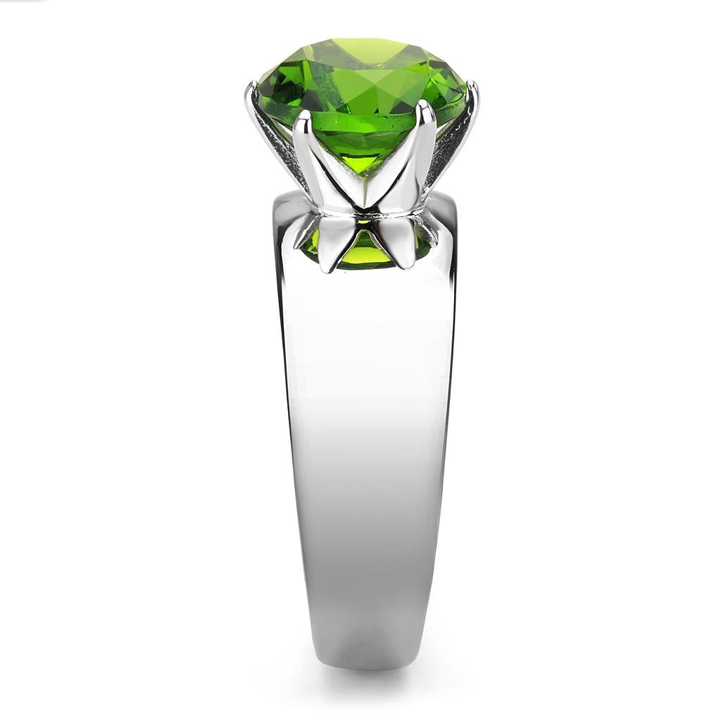 High polished stainless steel ring featuring a vibrant synthetic glass peridot stone, showcasing a sleek and modern design.