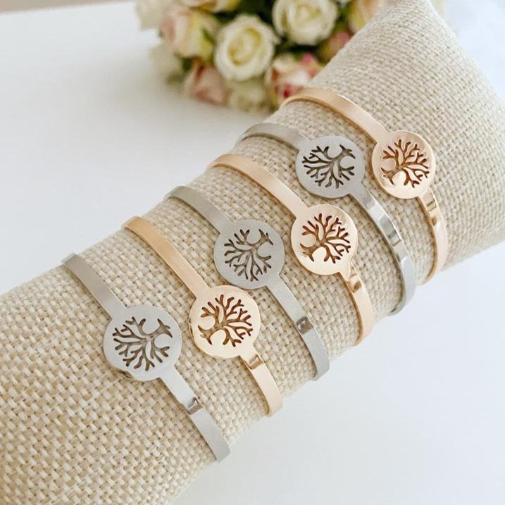 A beautiful Tree of Life Bracelet in rose gold and silver, showcasing intricate family tree design, adjustable fit, and tarnish-resistant stainless steel material.