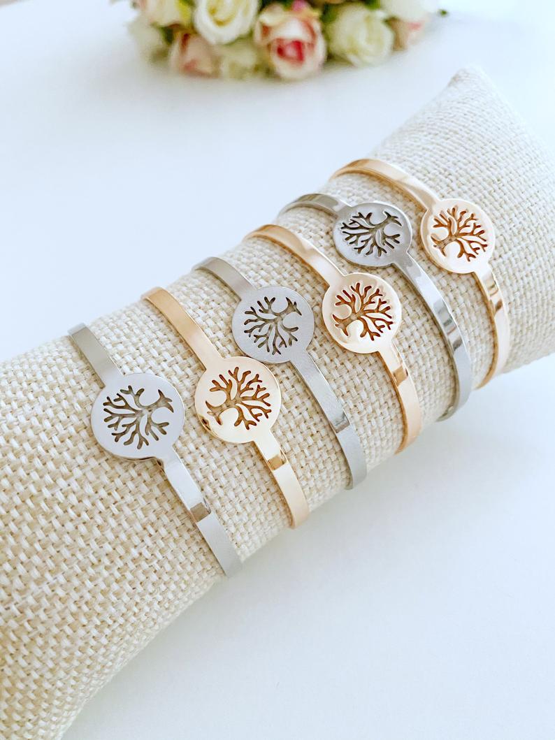 A beautiful Tree of Life Bracelet in rose gold and silver, showcasing intricate family tree design, adjustable fit, and tarnish-resistant stainless steel material.