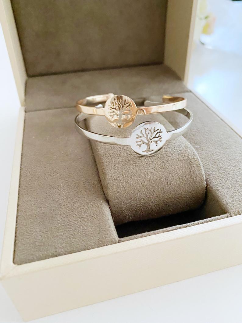 A beautiful Tree of Life Bracelet in rose gold and silver, showcasing intricate family tree design, adjustable fit, and tarnish-resistant stainless steel material.