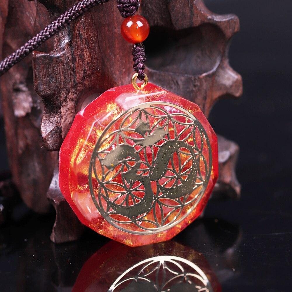 Tree Of Life Orgonite Necklace featuring a geometric pendant made of white crystal and resin, hung on a rope chain.