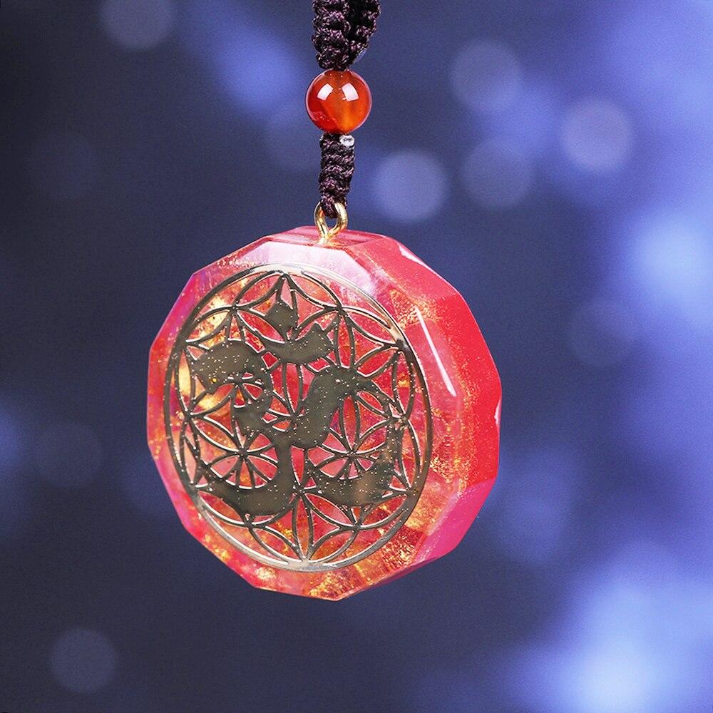 Tree Of Life Orgonite Necklace featuring a geometric pendant made of white crystal and resin, hung on a rope chain.