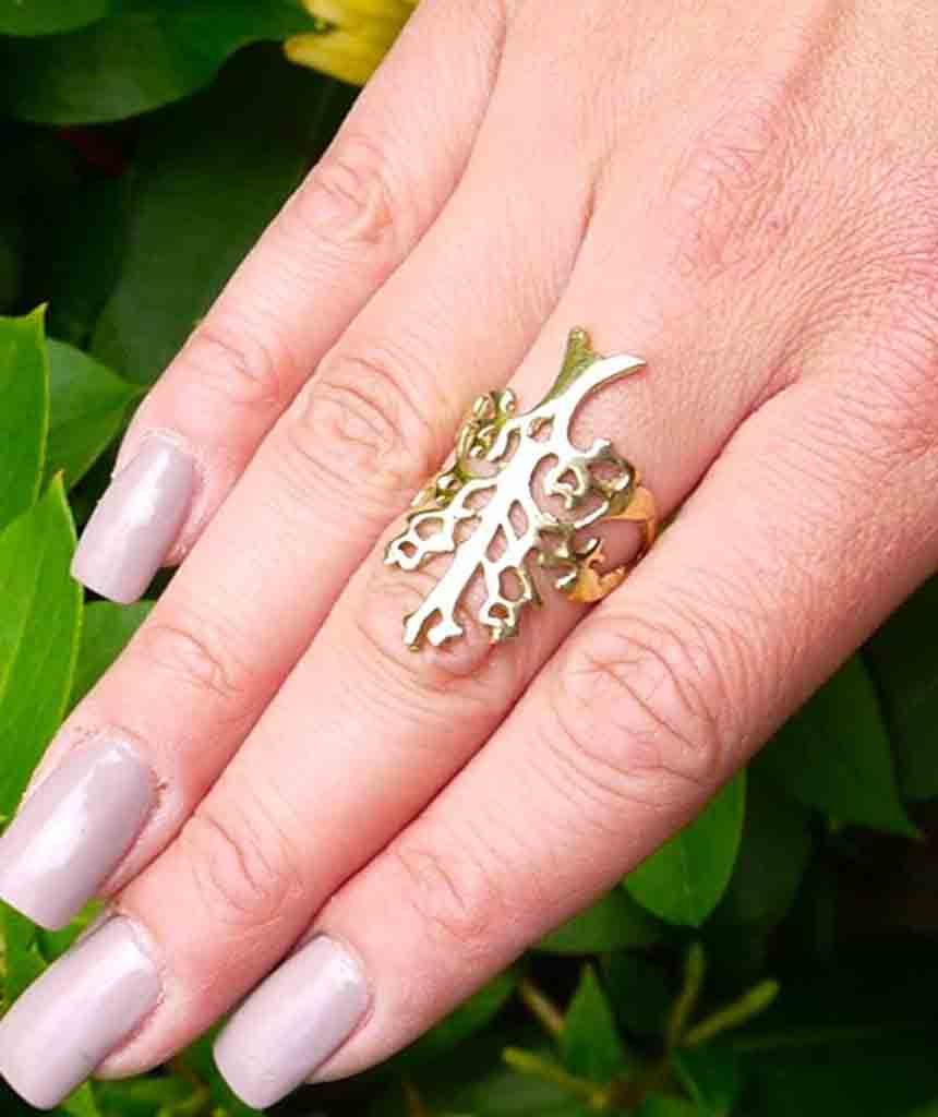 A beautifully crafted Tree of Life Ring featuring an intricate tree medallion design, made from hypoallergenic brass and silver.