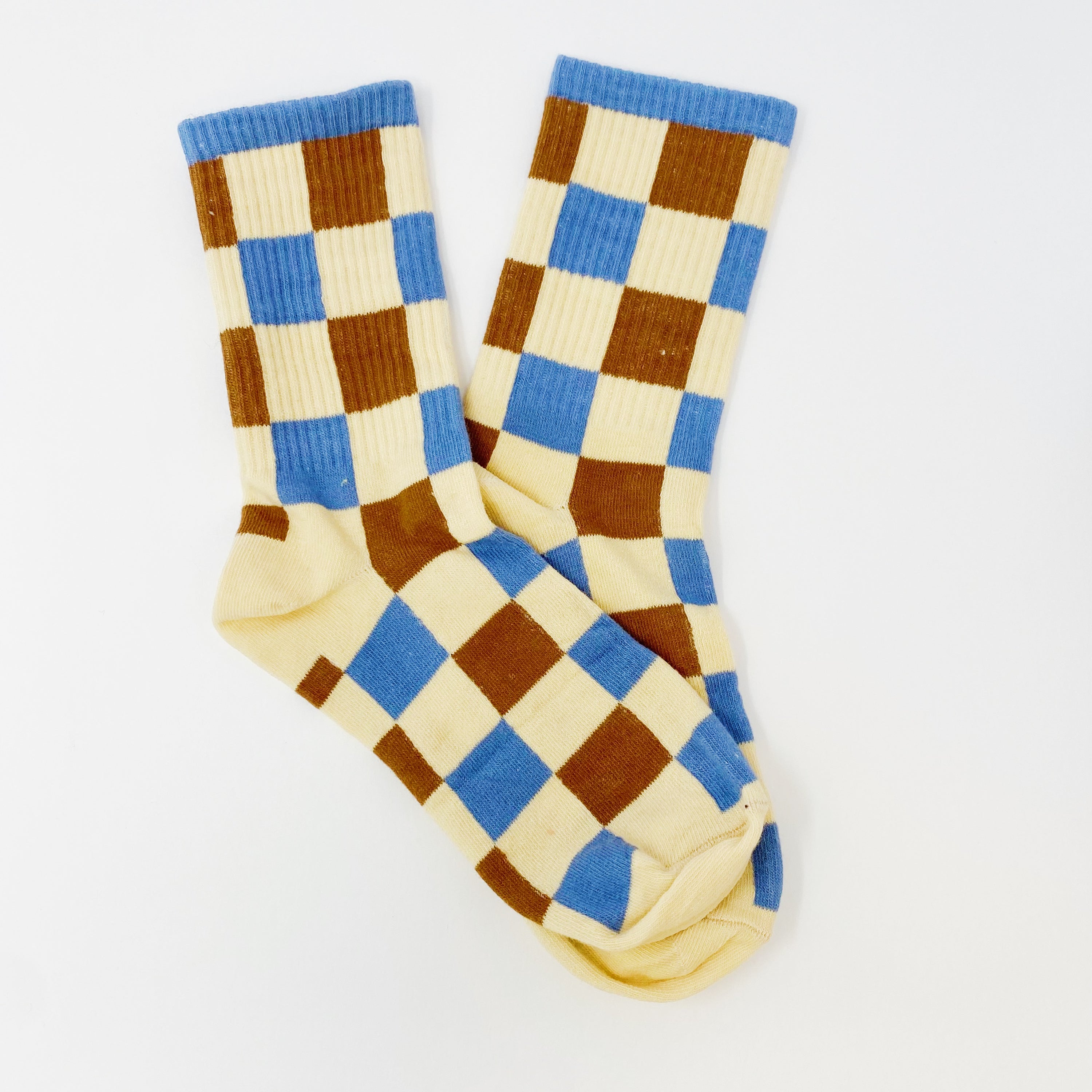 Trendy Pattern Trio Socks Set featuring three stylish pairs in unique designs, packaged in a clear cello bag.