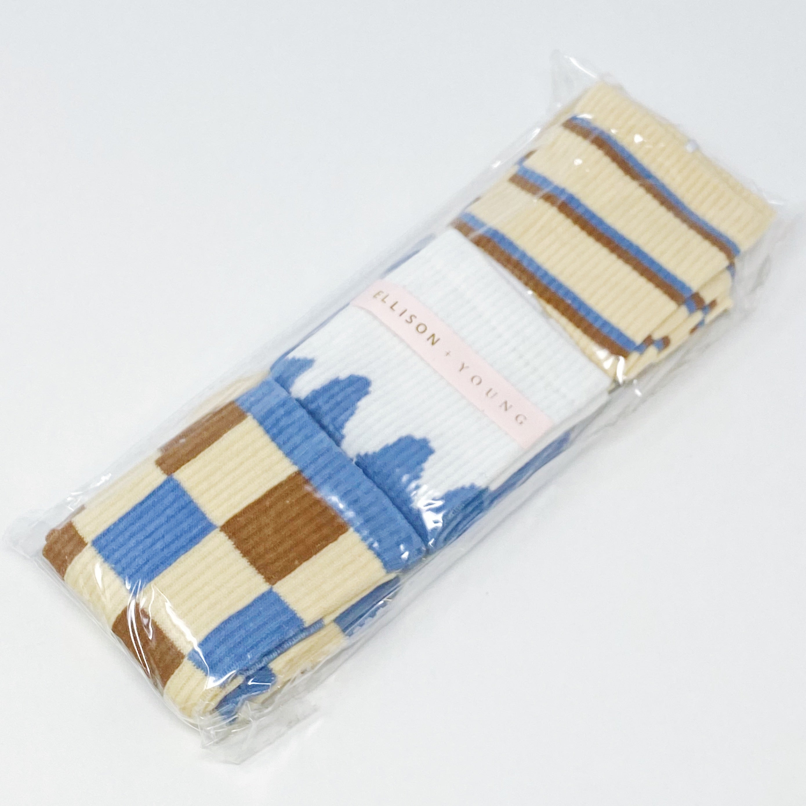 Trendy Pattern Trio Socks Set featuring three stylish pairs in unique designs, packaged in a clear cello bag.