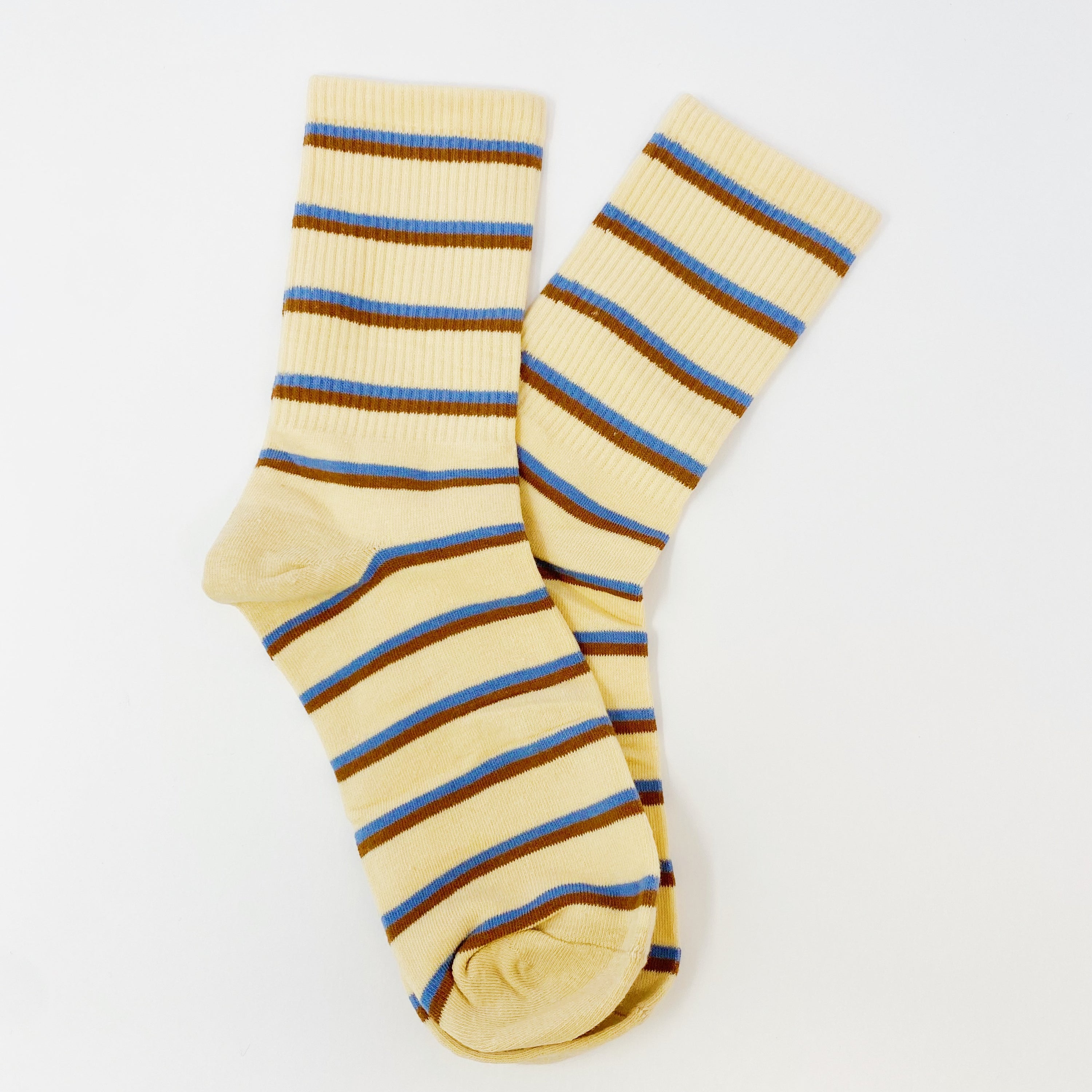 Trendy Pattern Trio Socks Set featuring three stylish pairs in unique designs, packaged in a clear cello bag.