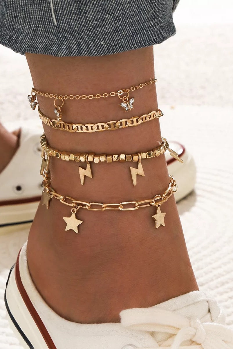 Trendy Player Anklet Set featuring four stylish gold plated anklets with adjustable sizes.