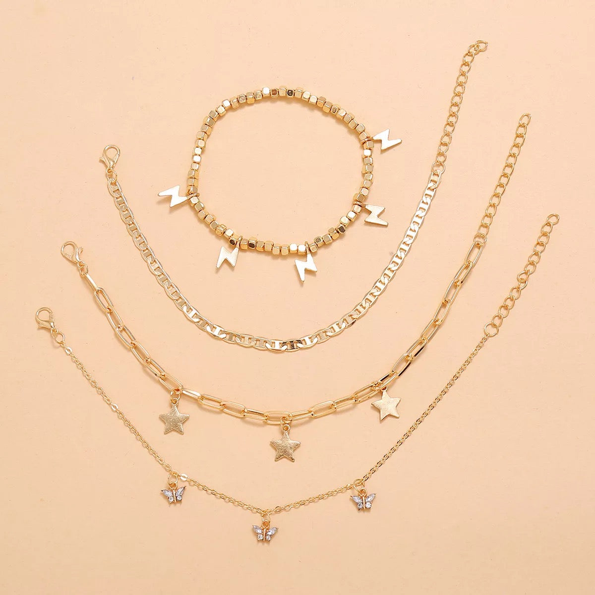 Trendy Player Anklet Set featuring four stylish gold plated anklets with adjustable sizes.