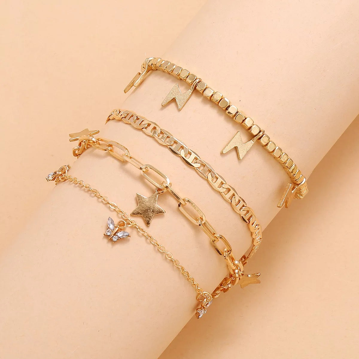 Trendy Player Anklet Set featuring four stylish gold plated anklets with adjustable sizes.