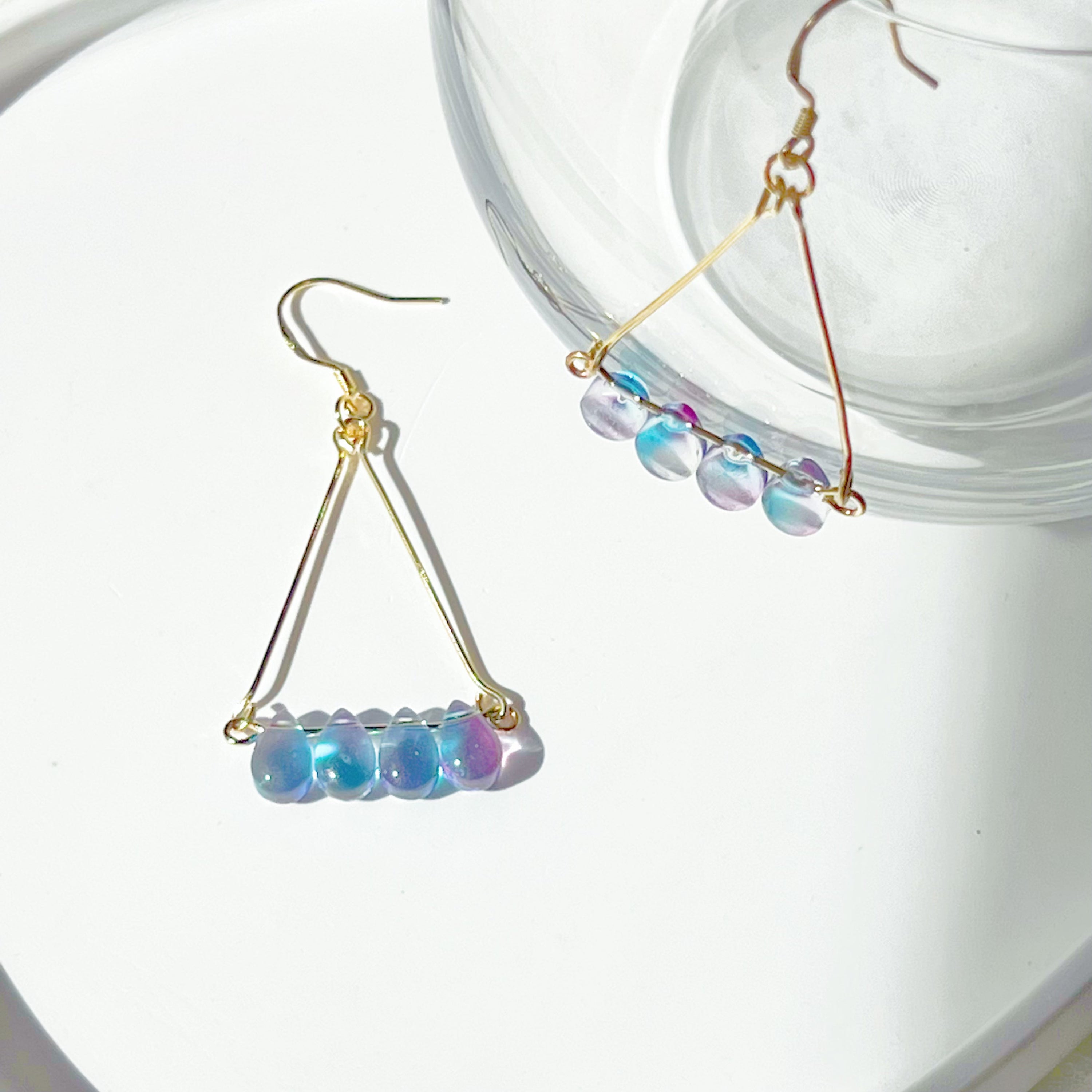 Elegant Triangle Blue Water Drop Raindrop Earrings featuring blue and purple acrylic beads with sterling silver ear wires.