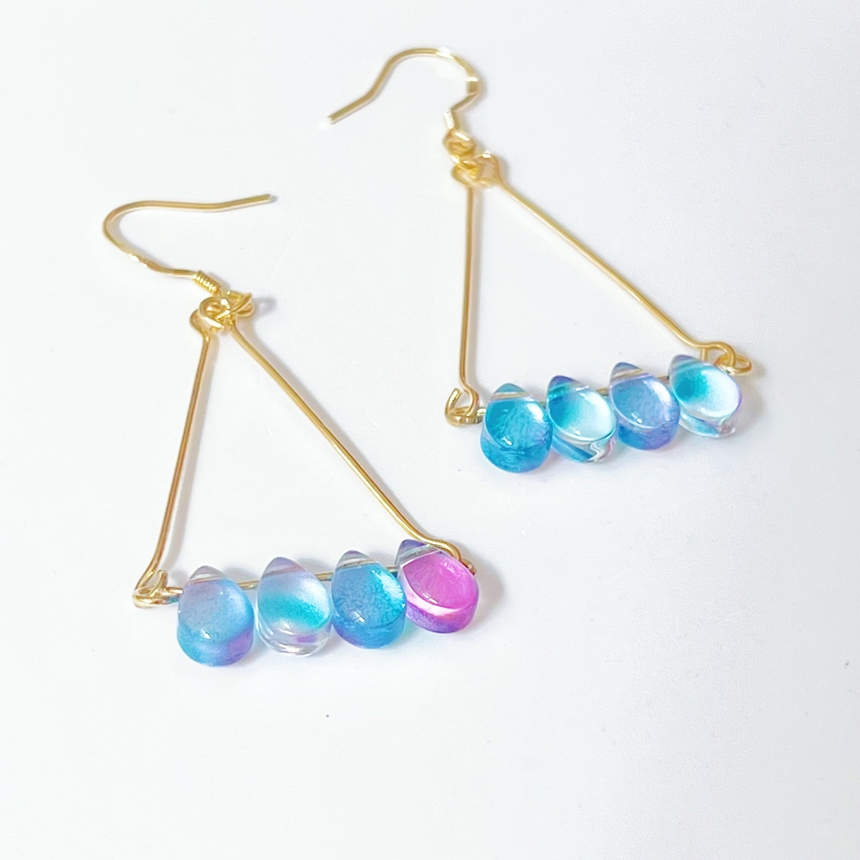 Elegant Triangle Blue Water Drop Raindrop Earrings featuring blue and purple acrylic beads with sterling silver ear wires.