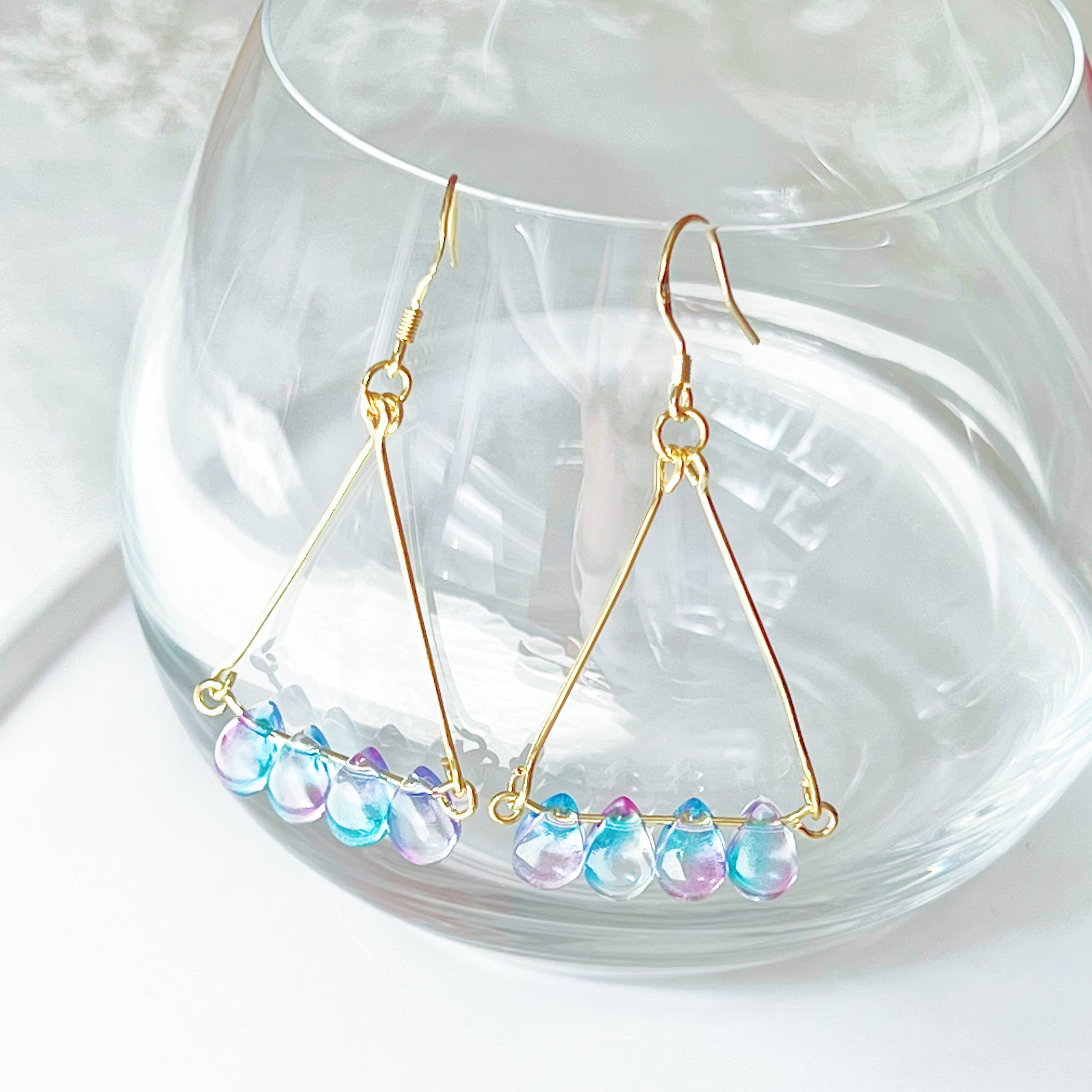 Elegant Triangle Blue Water Drop Raindrop Earrings featuring blue and purple acrylic beads with sterling silver ear wires.