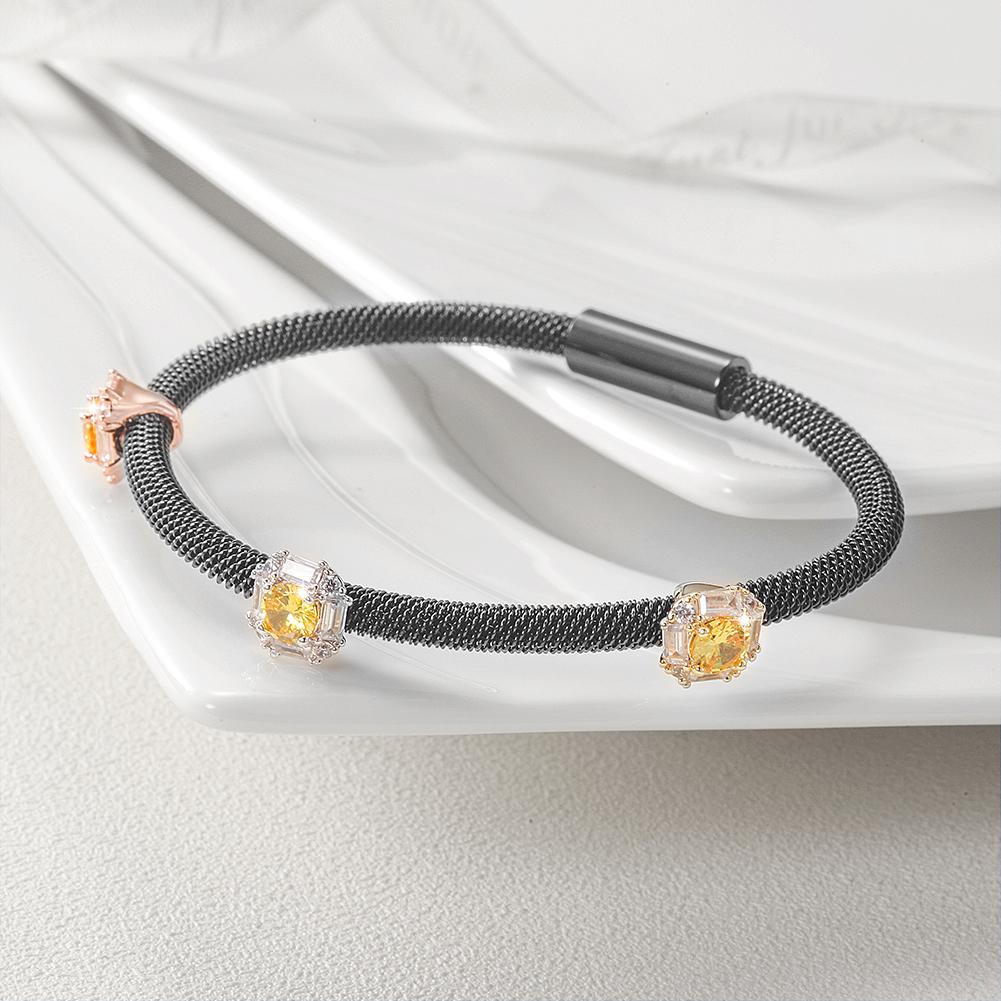 Tricolor PAVÉ Square Station Bangle made of surgical stainless steel with gold plating, showcasing its elegant design.