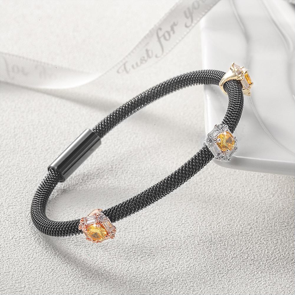 Tricolor PAVÉ Square Station Bangle made of surgical stainless steel with gold plating, showcasing its elegant design.