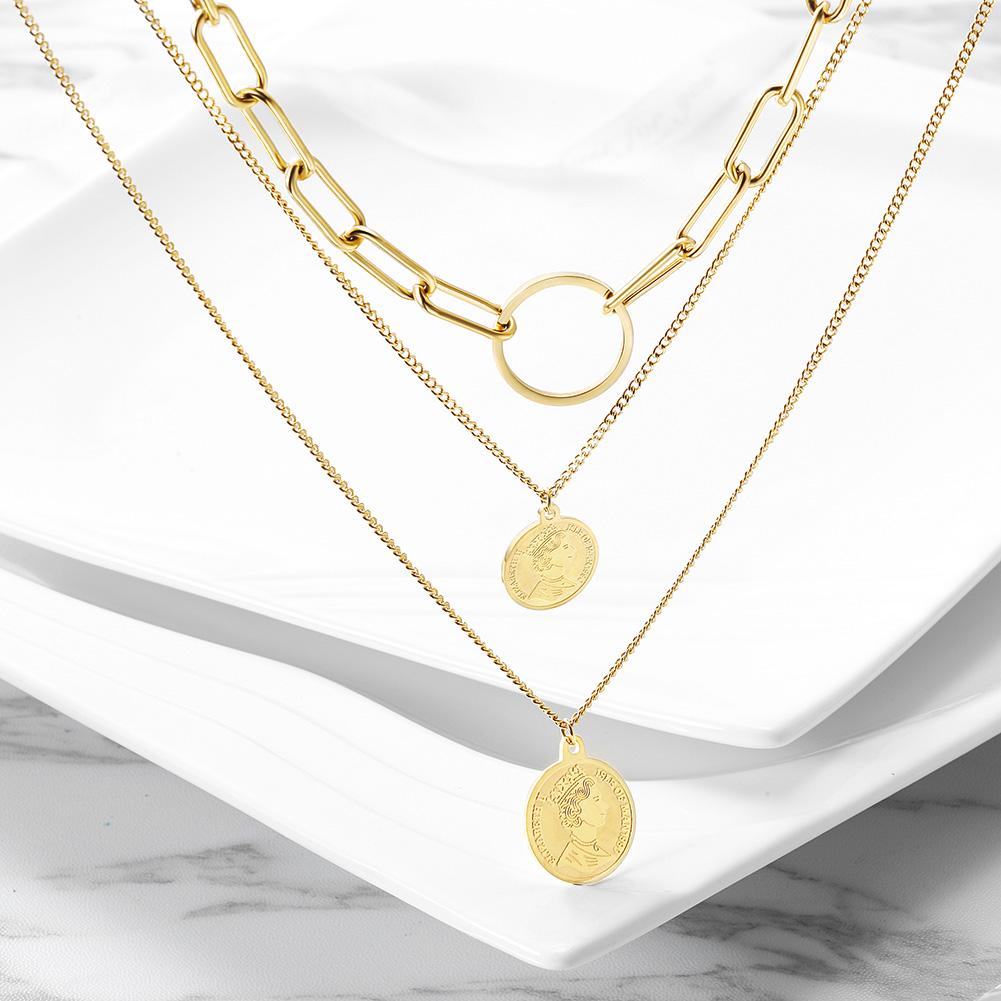 Triple Layered Coin Necklace made of stainless steel with gold plating, featuring three layers and coin pendants for a stylish look.