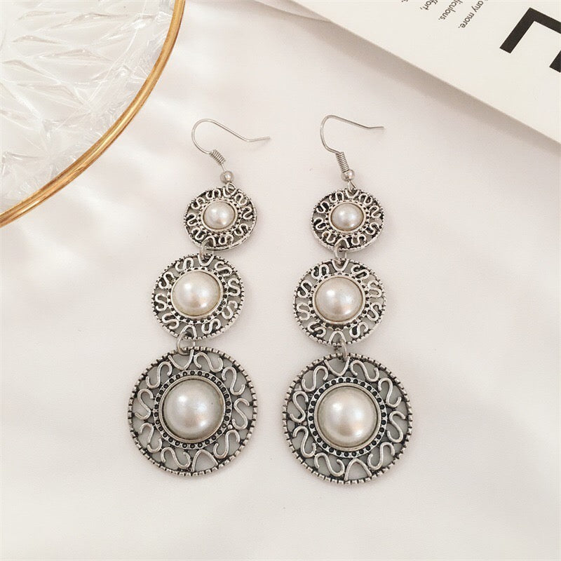 Elegant Triple Pearl Hat Earrings made of alloy, featuring three lustrous pearls in a stylish design.