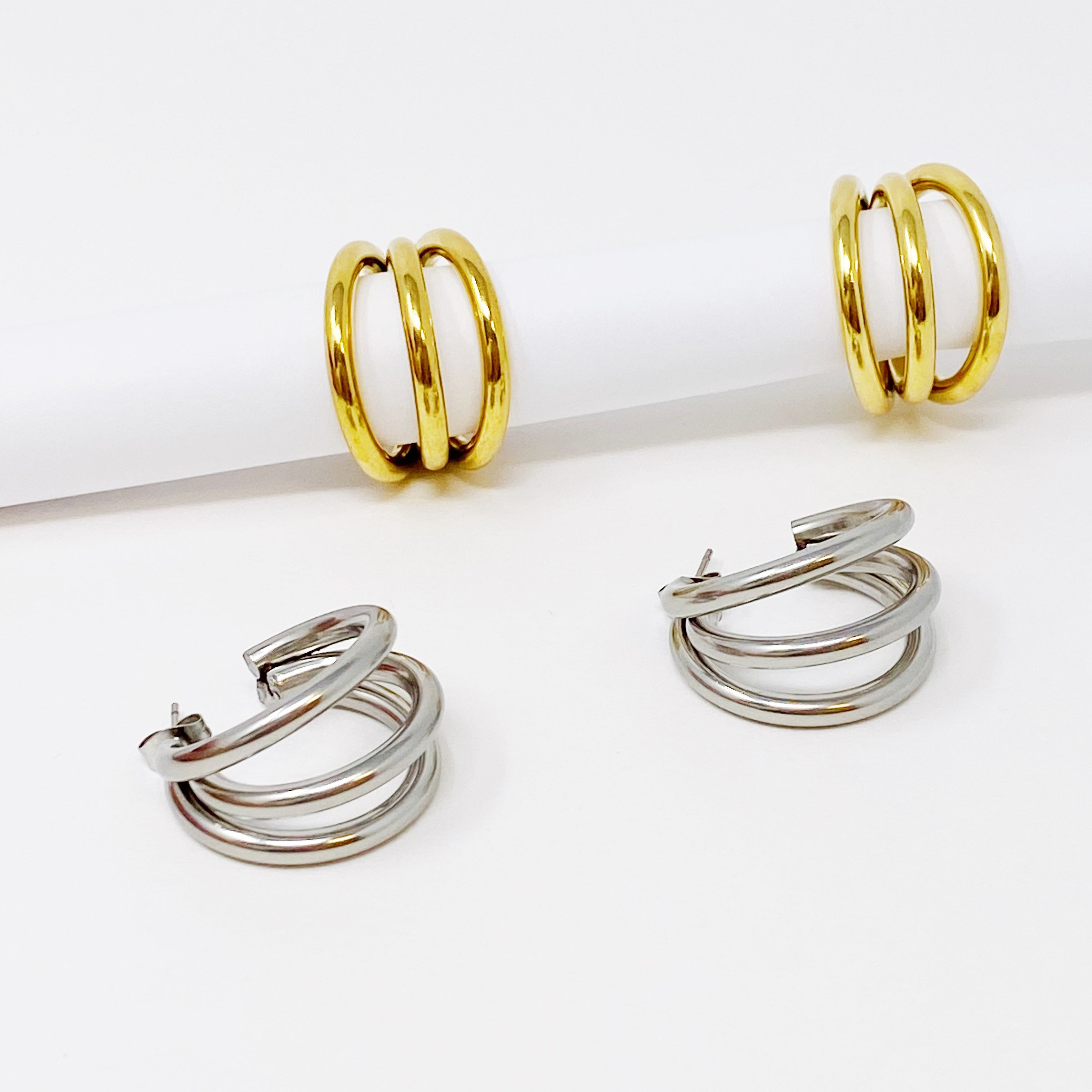 Triple hoop earrings in 18K gold plated stainless steel, showcasing a layered design perfect for any occasion.