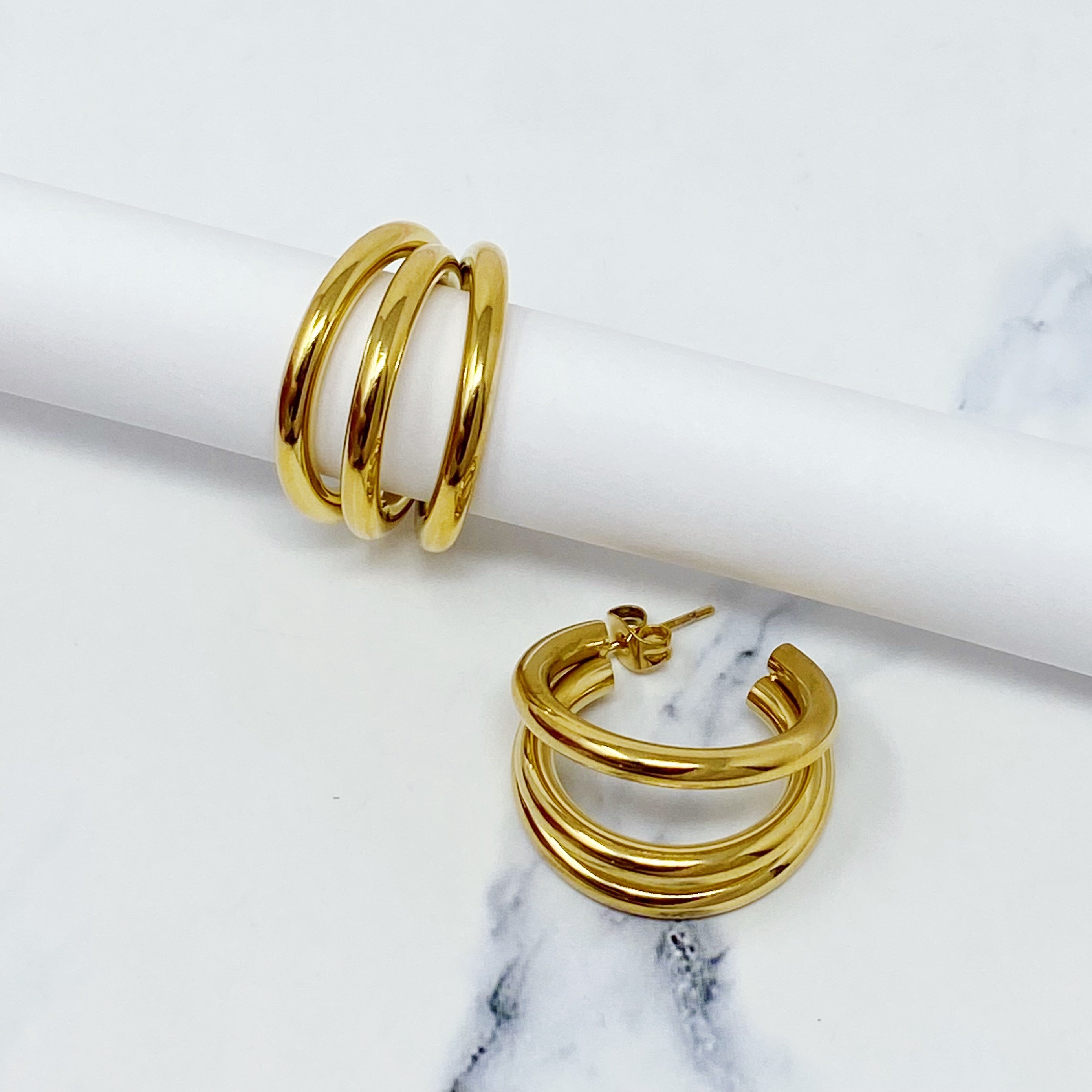 Triple hoop earrings in 18K gold plated stainless steel, showcasing a layered design perfect for any occasion.