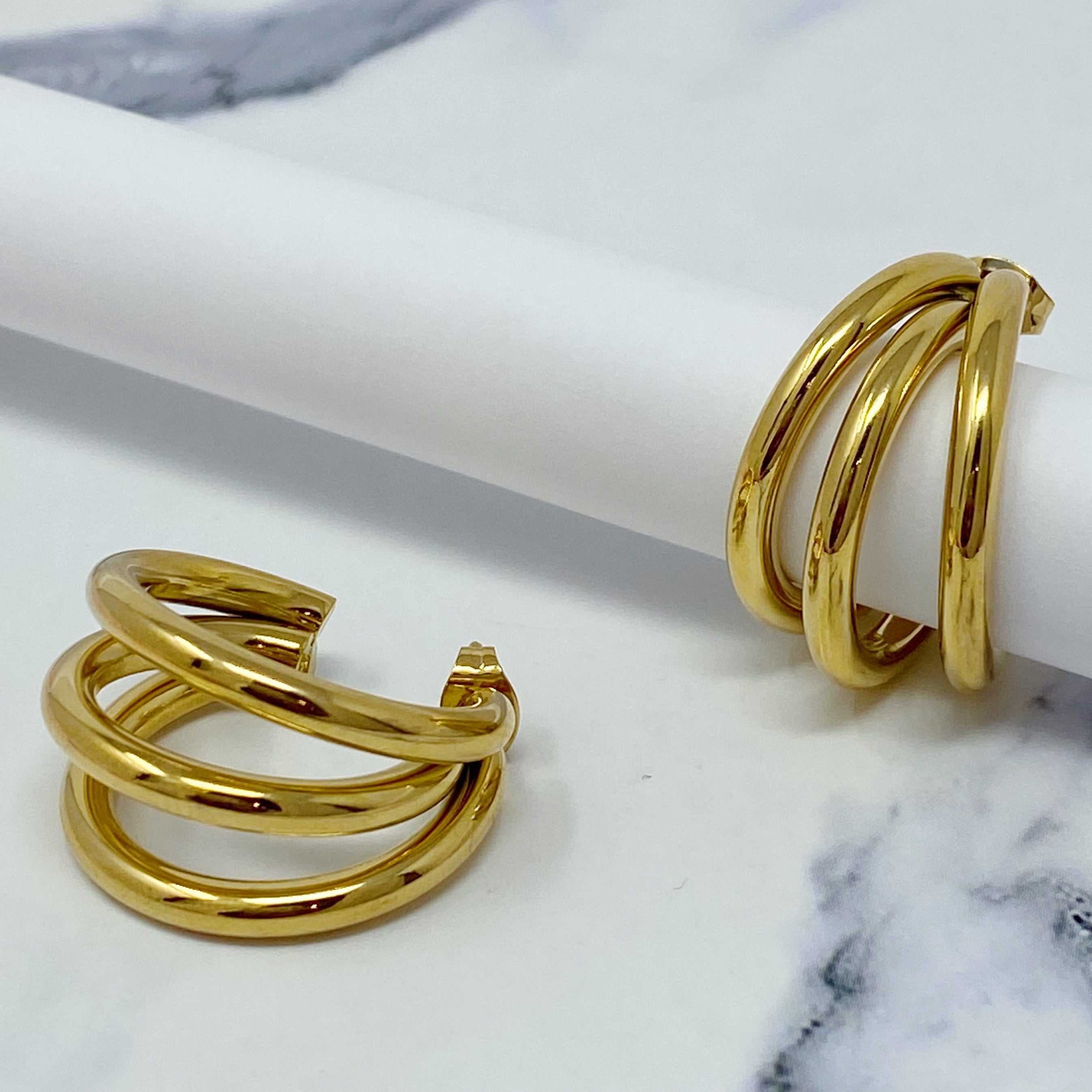 Triple hoop earrings in 18K gold plated stainless steel, showcasing a layered design perfect for any occasion.