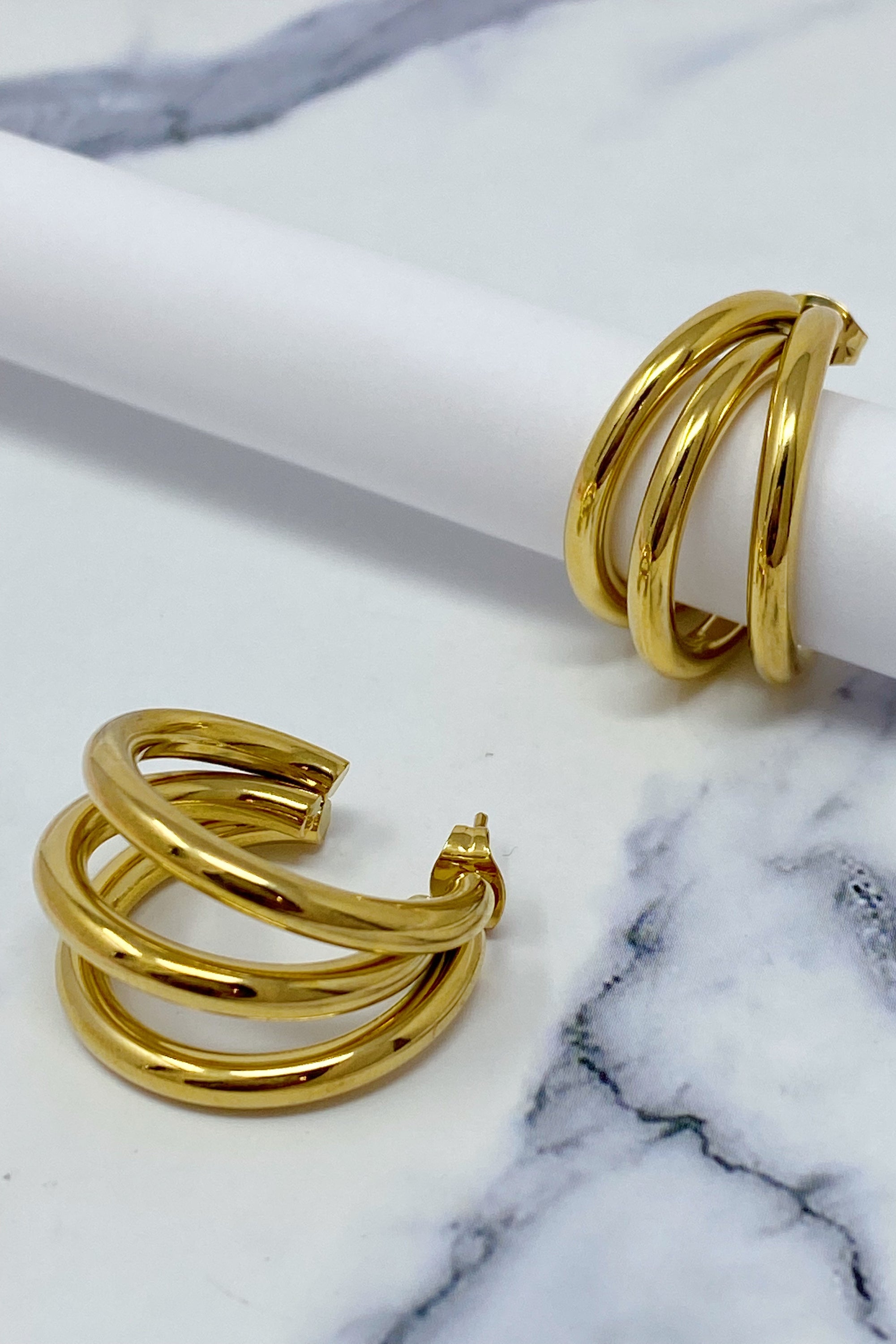 Triple hoop earrings in 18K gold plated stainless steel, showcasing a layered design perfect for any occasion.