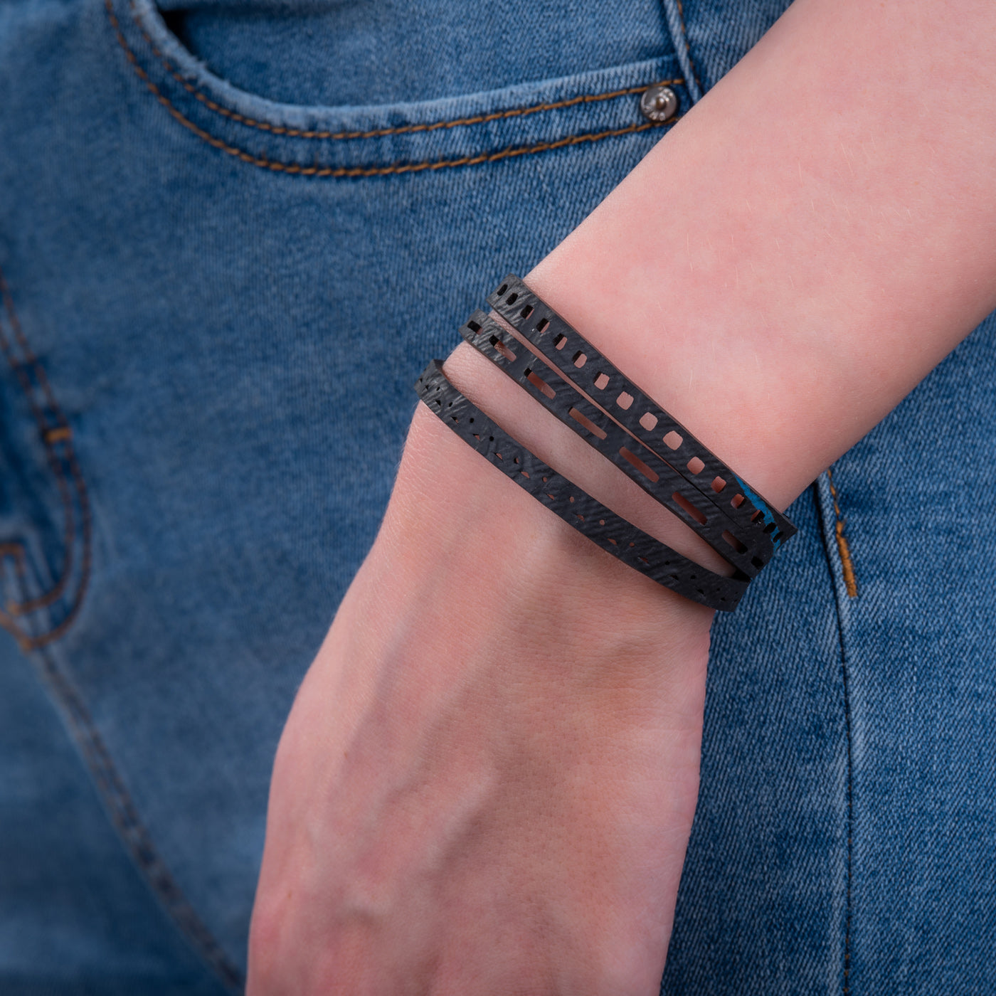 Triplet Unisex Inner Tube Bracelet featuring three unique bands made from recycled rubber, showcasing its eco-friendly design.