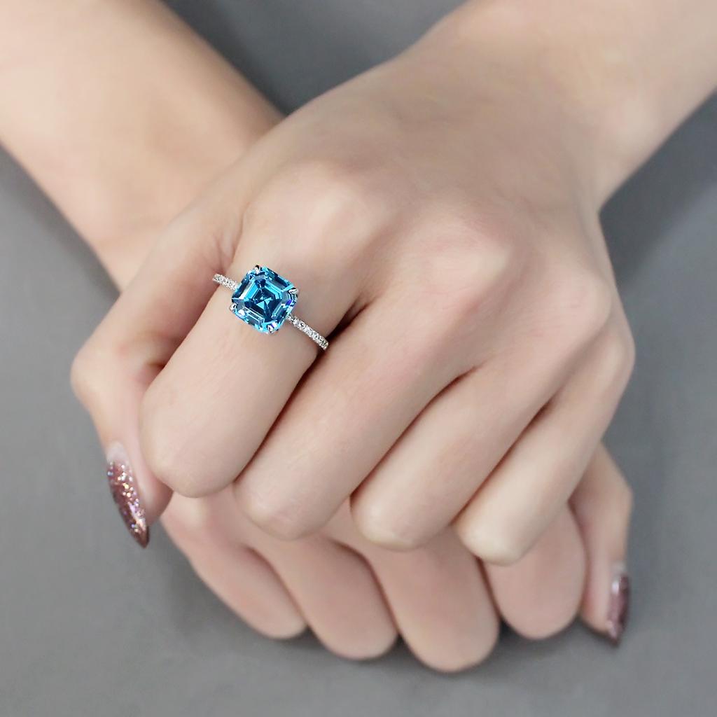 TS178 Rhodium 925 Sterling Silver Ring featuring a sea blue cubic stone, showcasing its elegant design and high-quality materials.