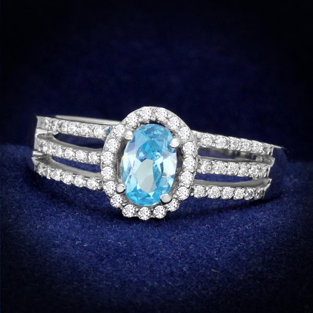 TS184 Rhodium 925 Sterling Silver Ring featuring a AAA Grade CZ in a vibrant sea blue color, elegantly designed for any occasion.