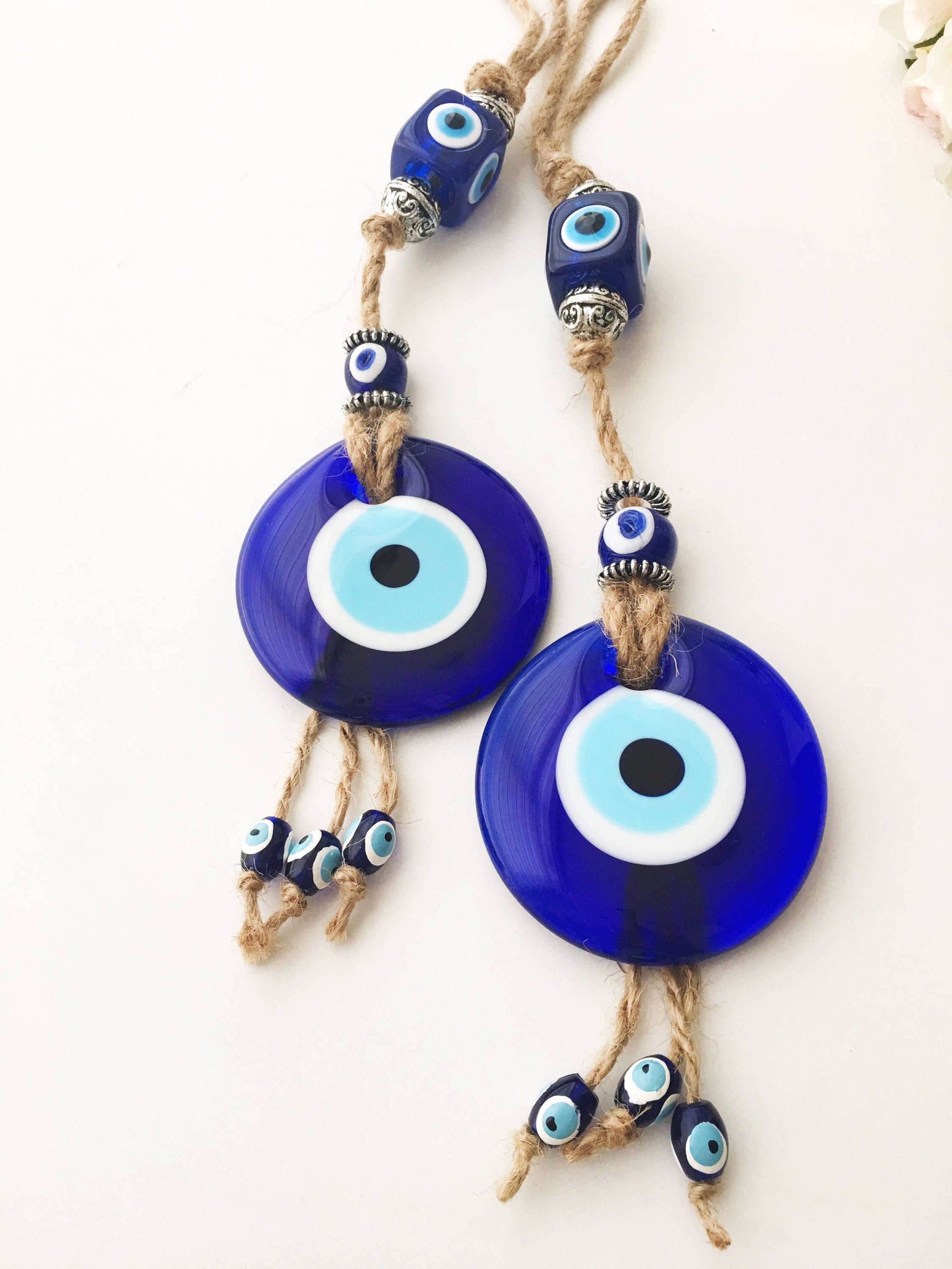 Handmade Turkish Evil Eye Home Decoration featuring blue glass beads and intricate design, perfect for wall hanging.