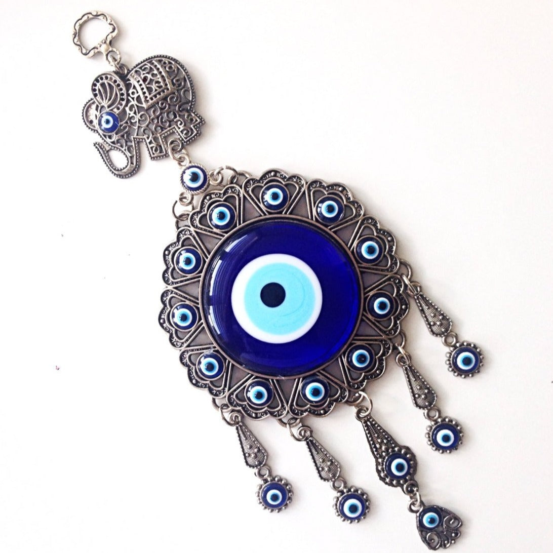 Handmade Turkish Evil Eye Wall Hanging featuring unique metal figures and glass evil eyes, symbolizing protection and good luck.