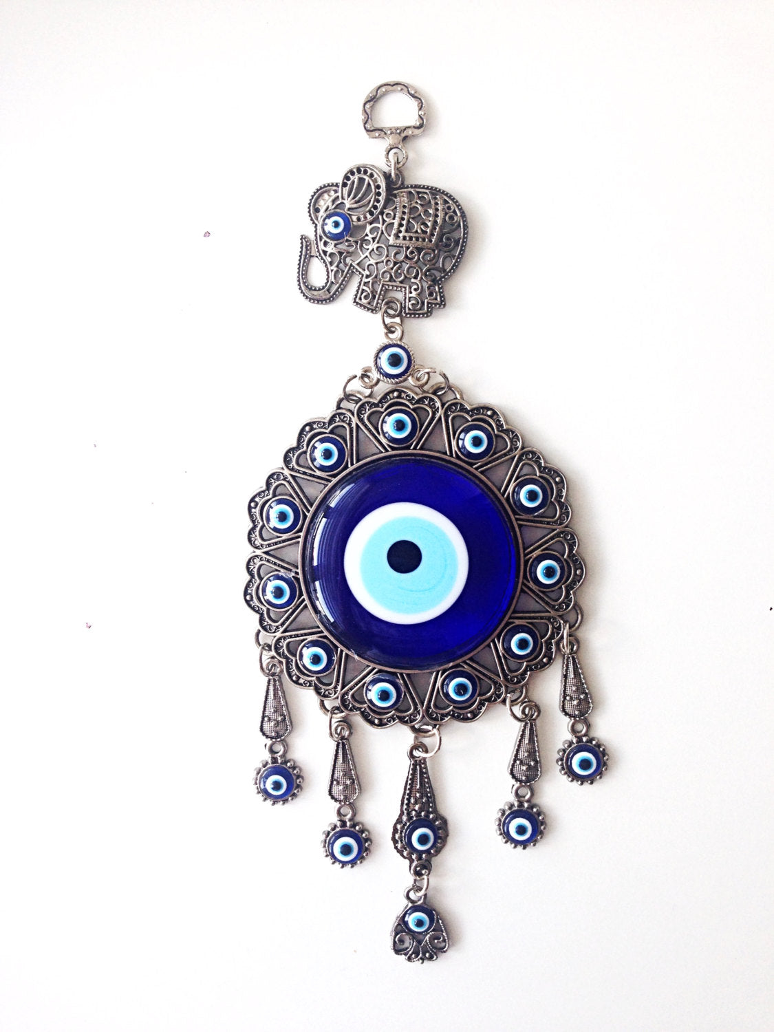 Handmade Turkish Evil Eye Wall Hanging featuring unique metal figures and glass evil eyes, symbolizing protection and good luck.