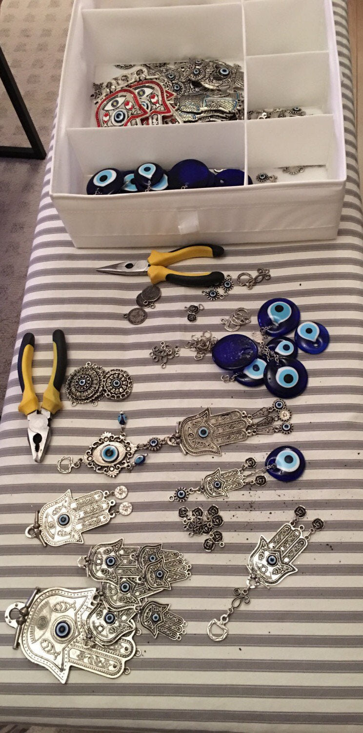 Handmade Turkish Evil Eye Wall Hanging featuring unique metal figures and glass evil eyes, symbolizing protection and good luck.