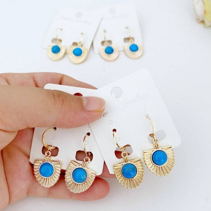 Handmade turquoise dangle earrings in gold and rose gold, showcasing a boho style perfect for women.