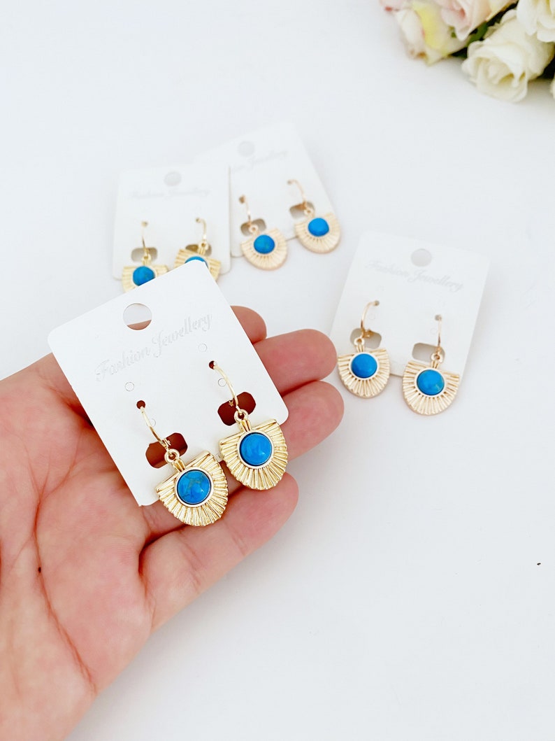 Handmade turquoise dangle earrings in gold and rose gold, showcasing a boho style perfect for women.