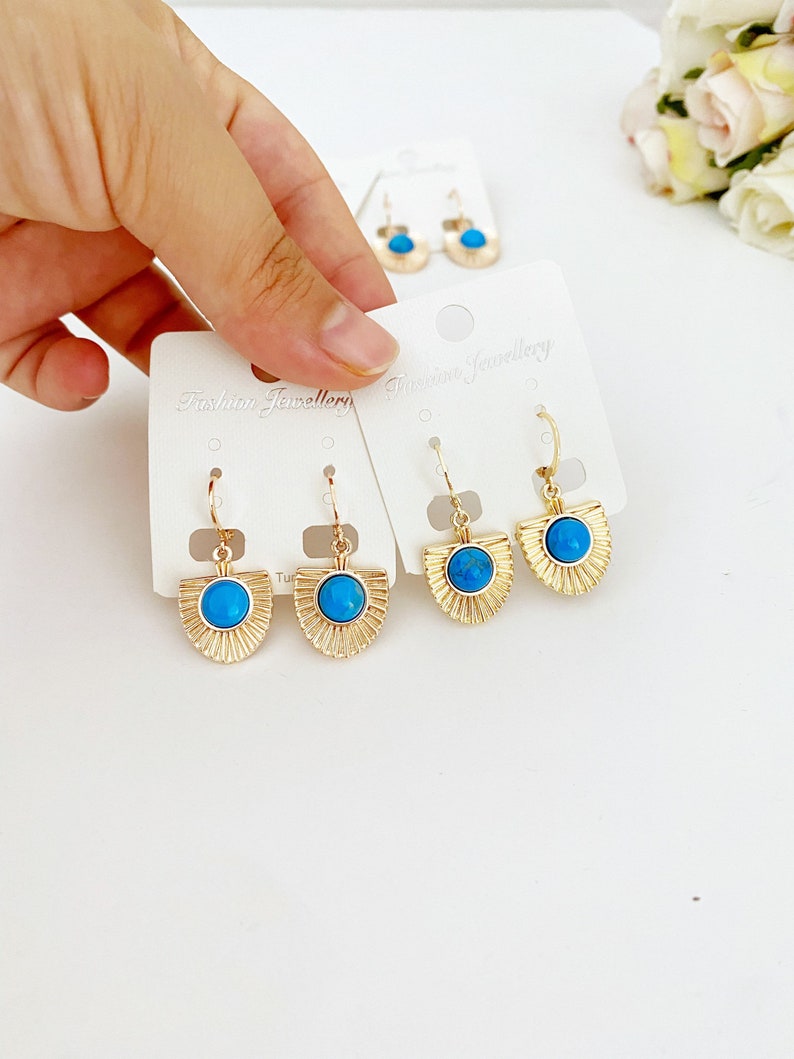 Handmade turquoise dangle earrings in gold and rose gold, showcasing a boho style perfect for women.