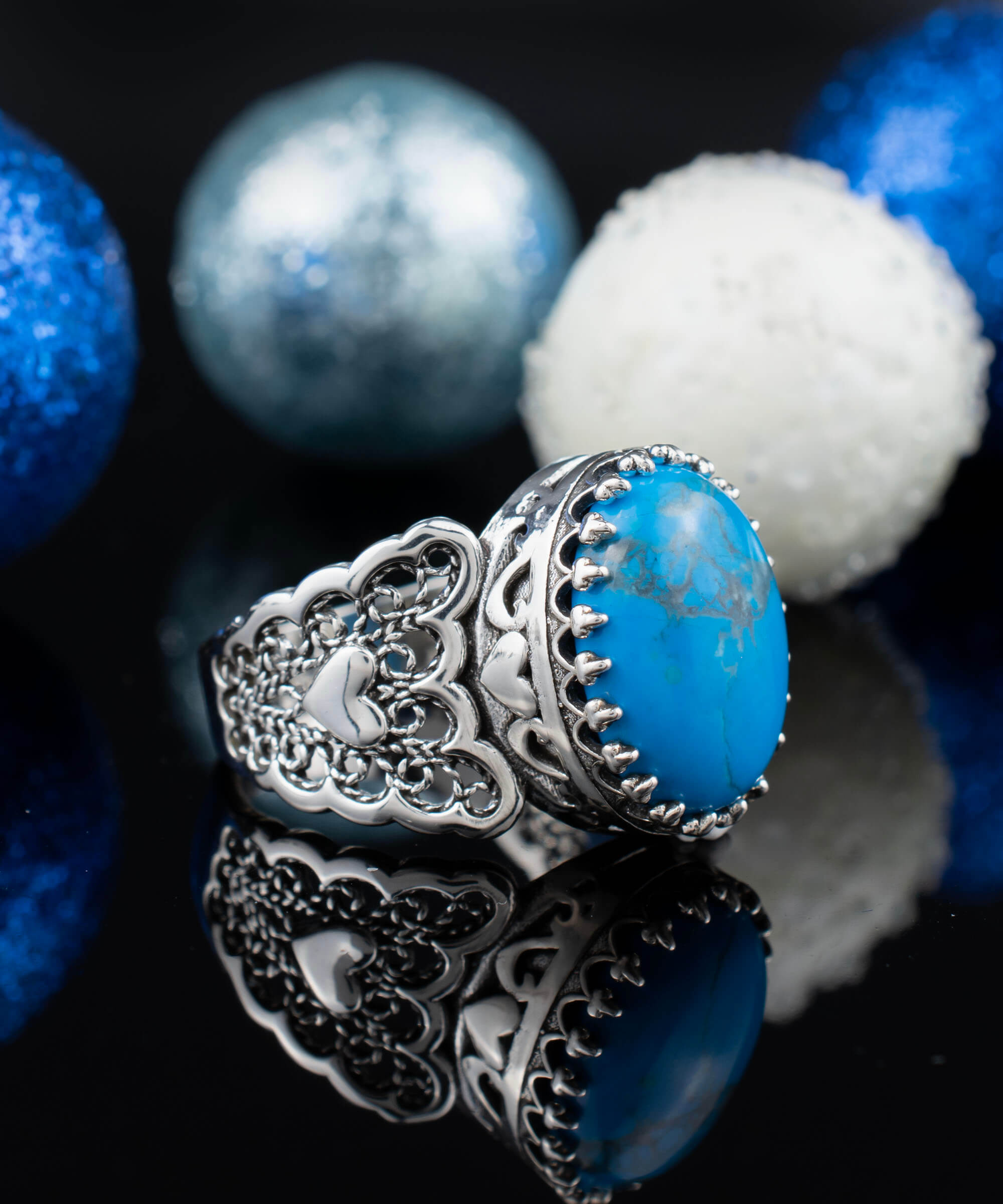 Turquoise gemstone double heart filigree ring made of 925 sterling silver, showcasing intricate design and vibrant teal color.