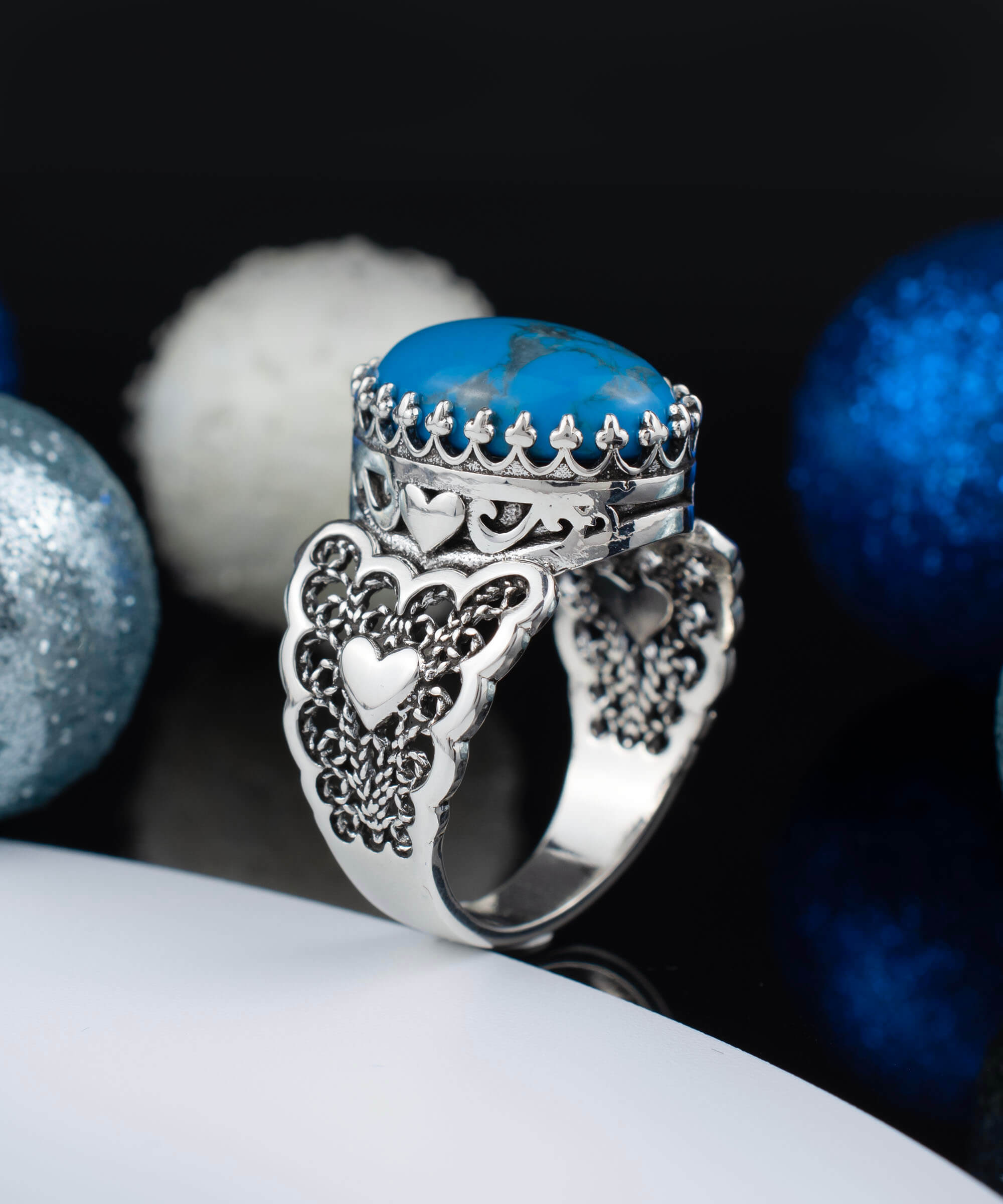 Turquoise gemstone double heart filigree ring made of 925 sterling silver, showcasing intricate design and vibrant teal color.