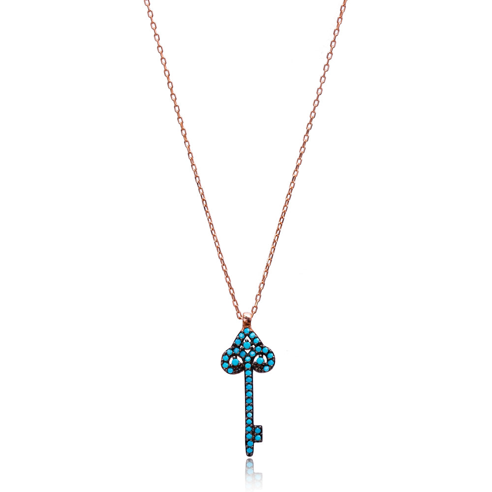 A beautiful TURQUOISE Key Necklace featuring a Nano Turquoise gemstone set in 925 Sterling Silver with yellow gold plating, adjustable length.