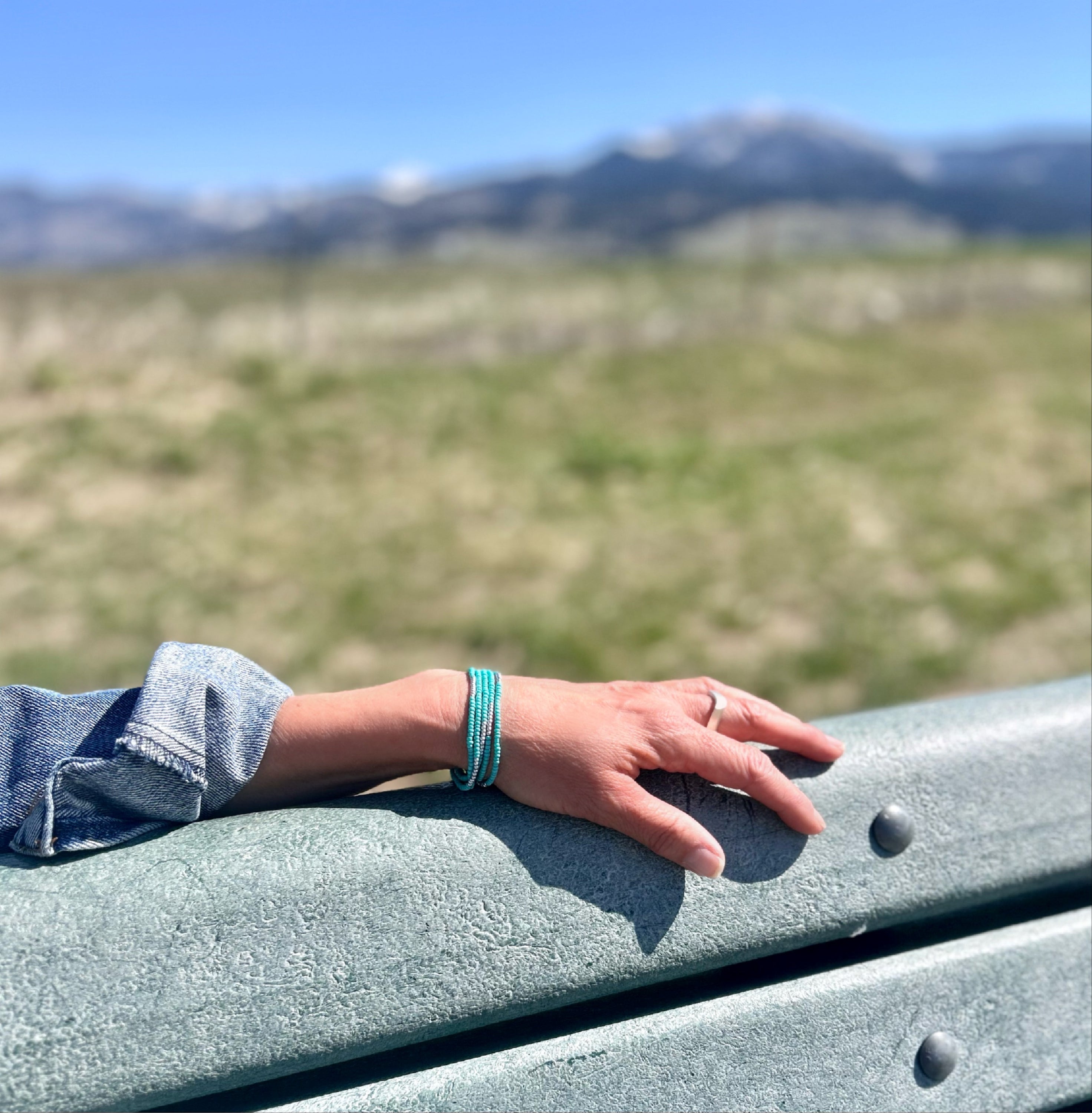 Turquoise silver-striped beaded 5-wrap bracelet showcasing vibrant Czech glass beads and metallic stripes.