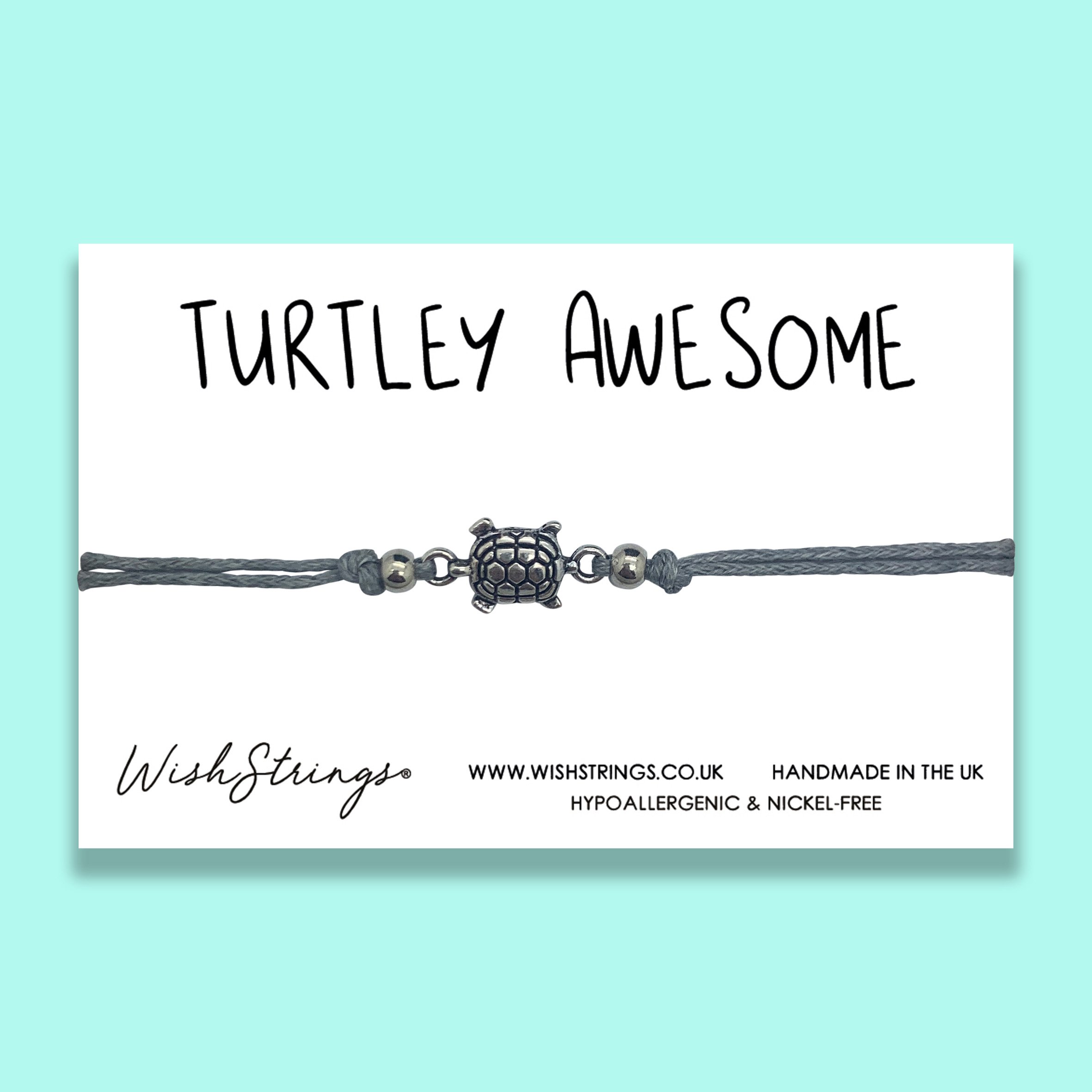 TURTLE Adjustable Cord Bracelet featuring a Tibetan charm, made from stretch elastic, displayed on a quality gloss card.