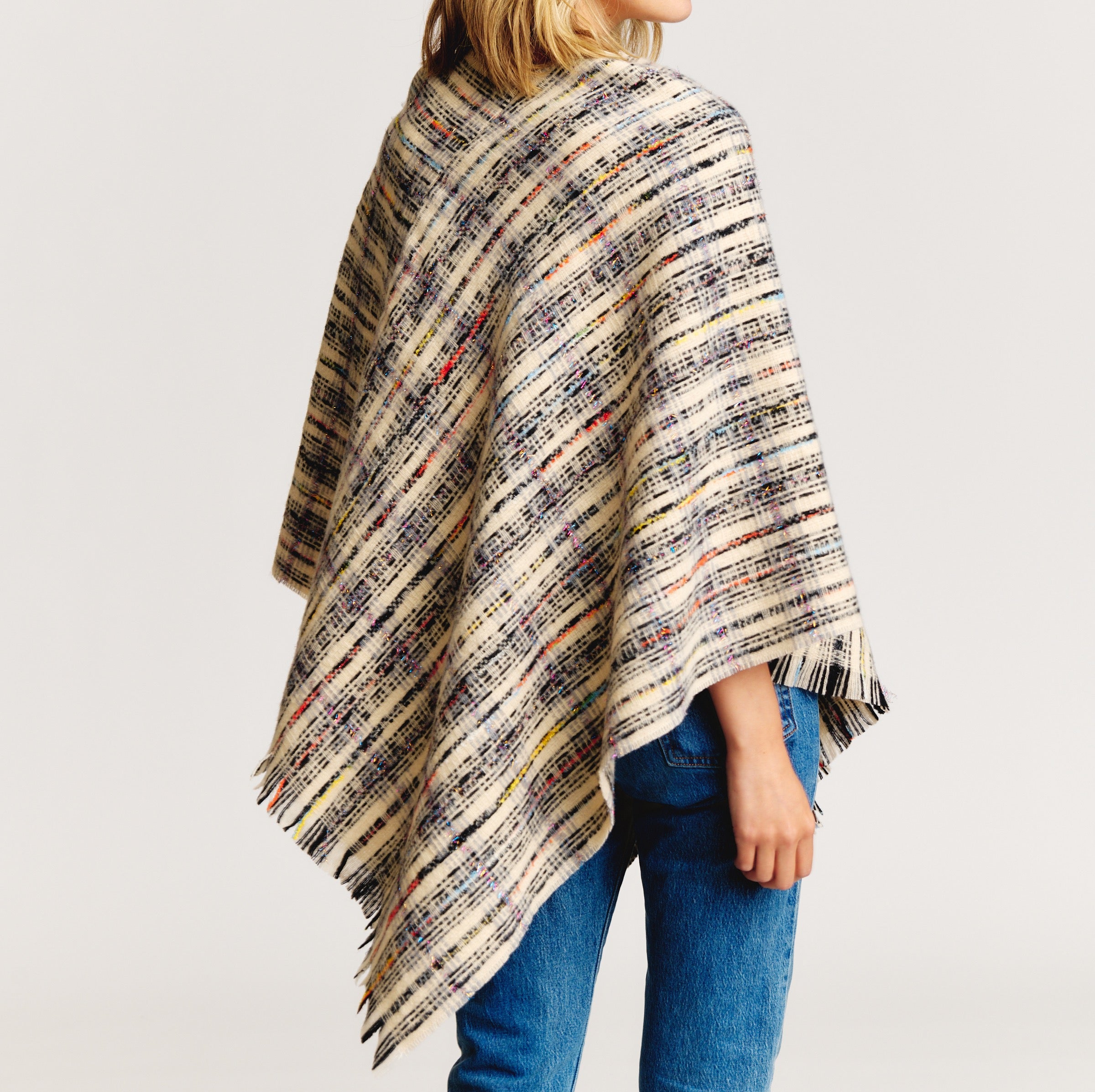 Tweed Please Luxe Poncho featuring a luxurious plaid pattern, perfect for stylish layering.