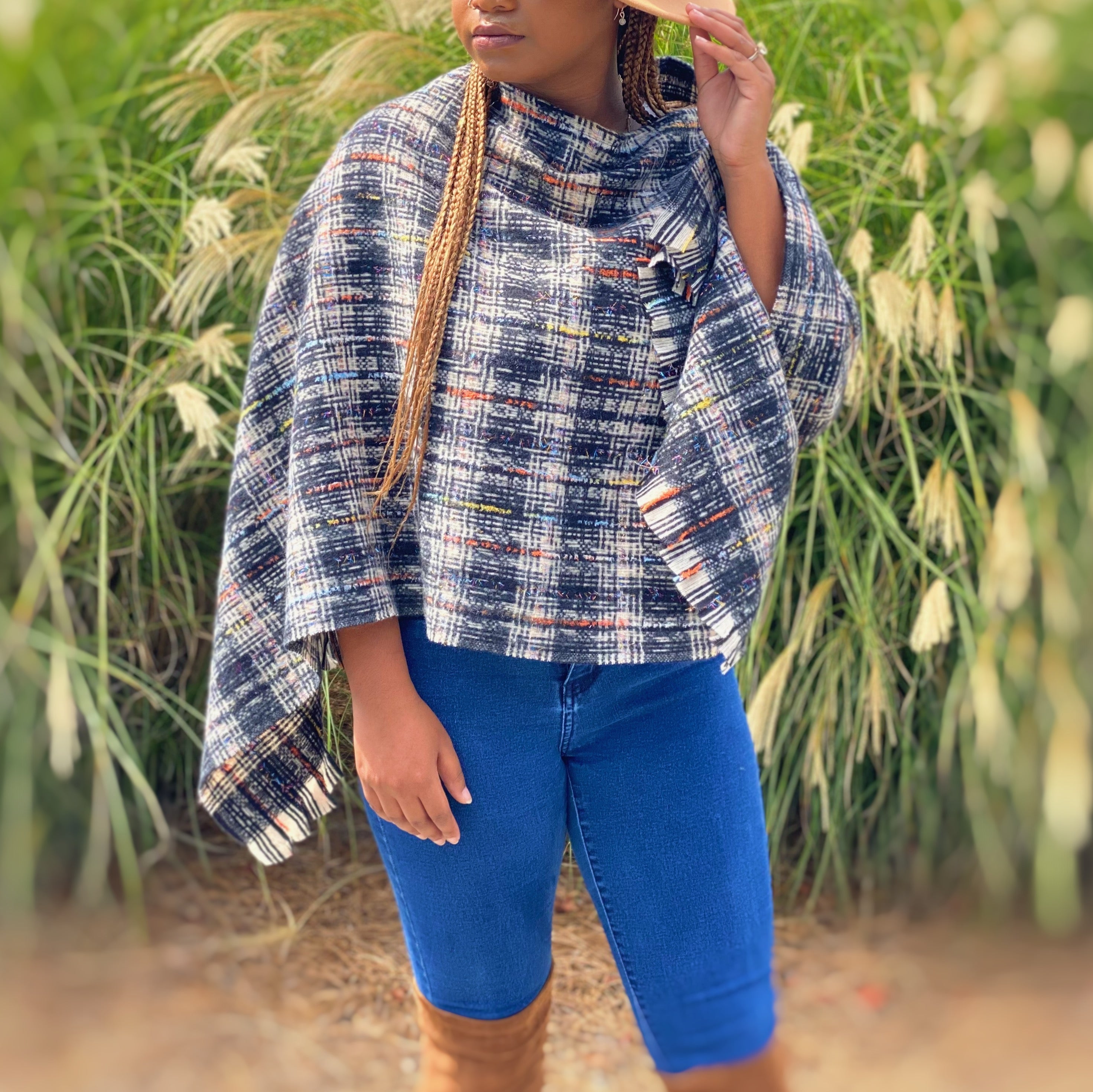 Tweed Please Luxe Poncho featuring a luxurious plaid pattern, perfect for stylish layering.