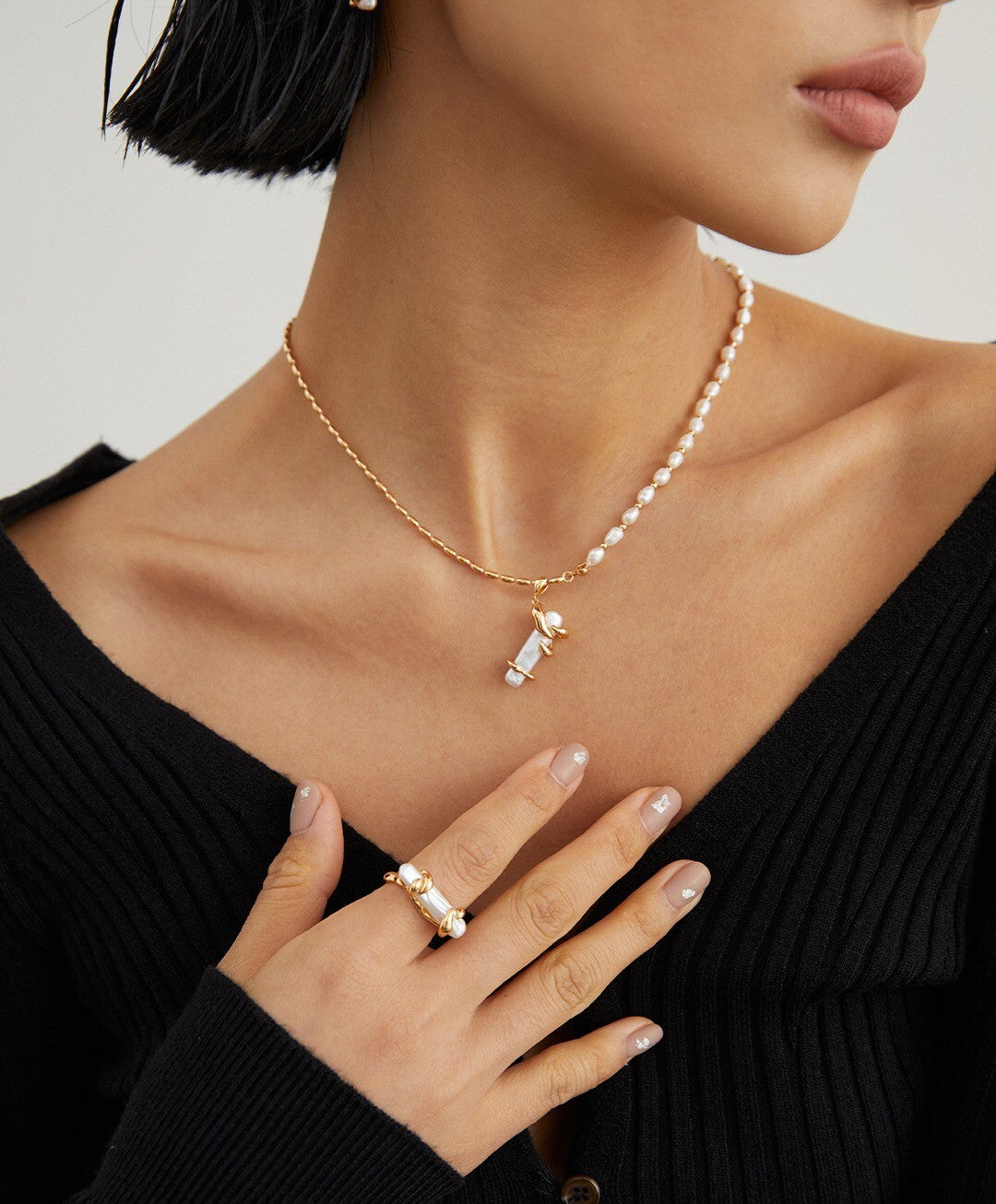 A beautiful Twine Pearl Ring featuring genuine freshwater pearls set in sterling silver with gold vermeil plating, showcasing elegance and craftsmanship.