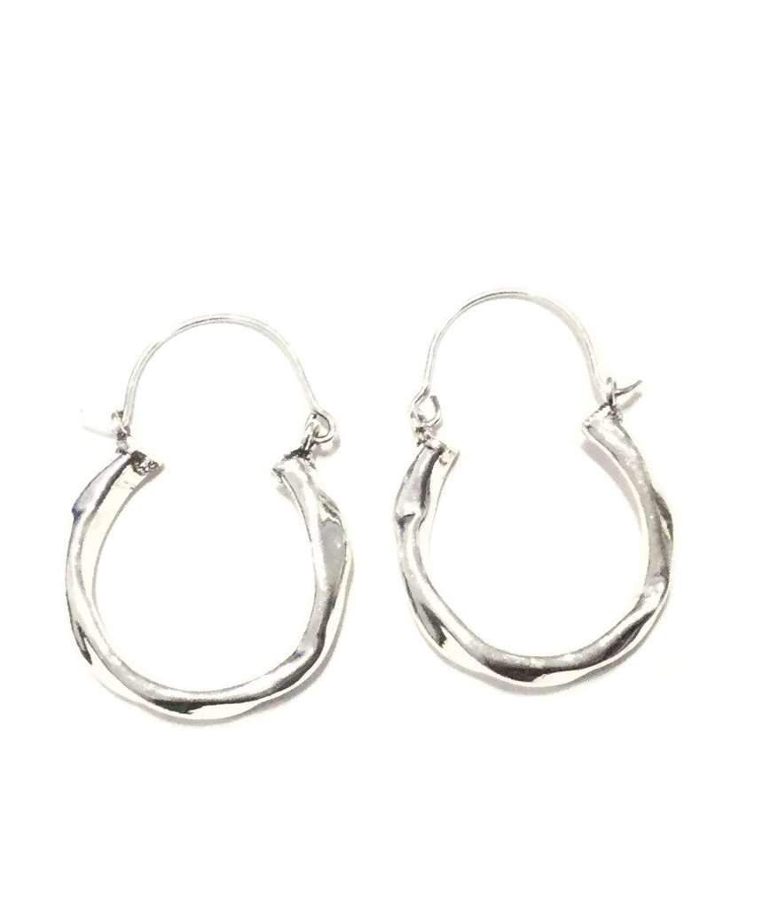 Elegant handmade twist hoop earrings in silver and gold, designed for sensitive skin with a chic twist design.