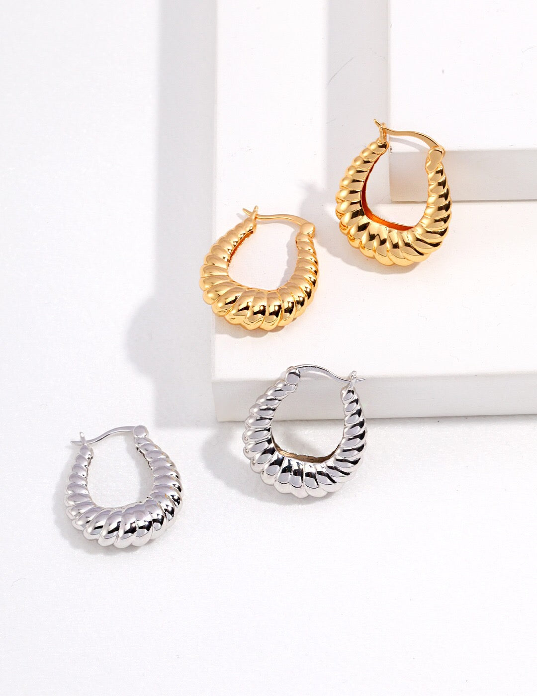 Elegant Twisted Stripe Stud Earrings made of sterling silver and gold vermeil, showcasing a modern twisted design.