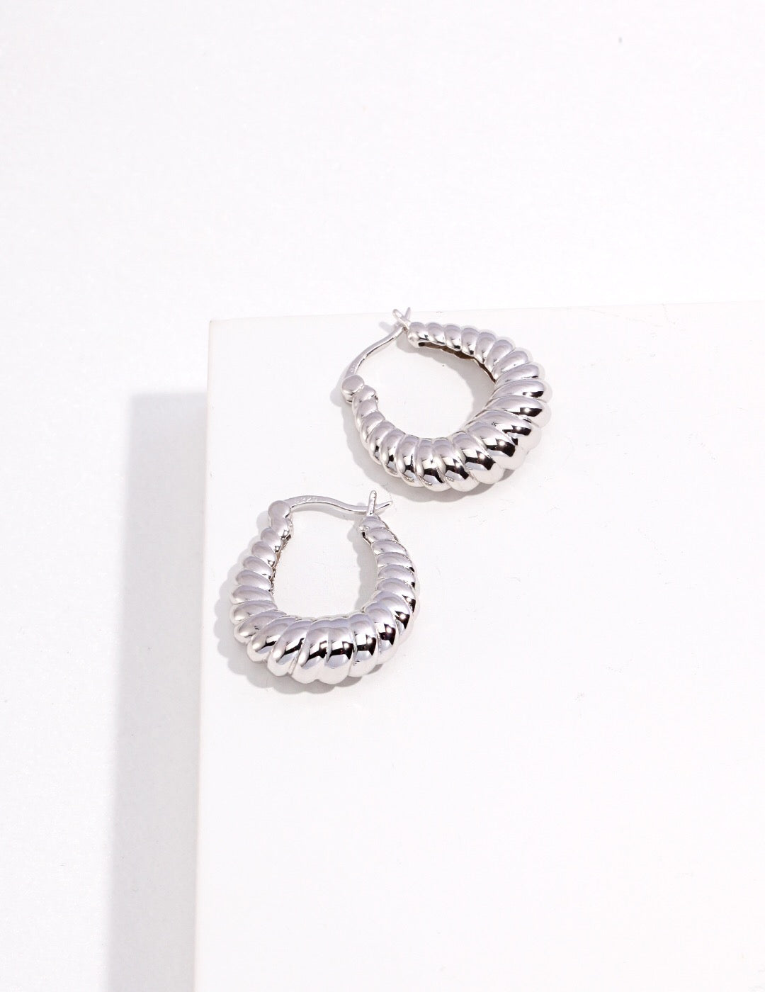 Elegant Twisted Stripe Stud Earrings made of sterling silver and gold vermeil, showcasing a modern twisted design.