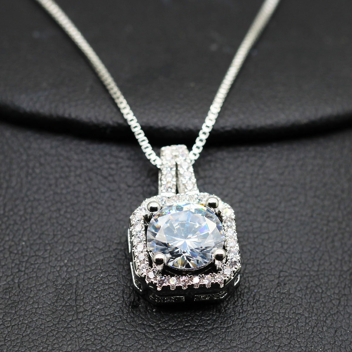 Two Carat Halo Cubic Zirconia Pendant Necklace featuring a stunning halo design with 18K white gold plating and genuine Austrian crystals.