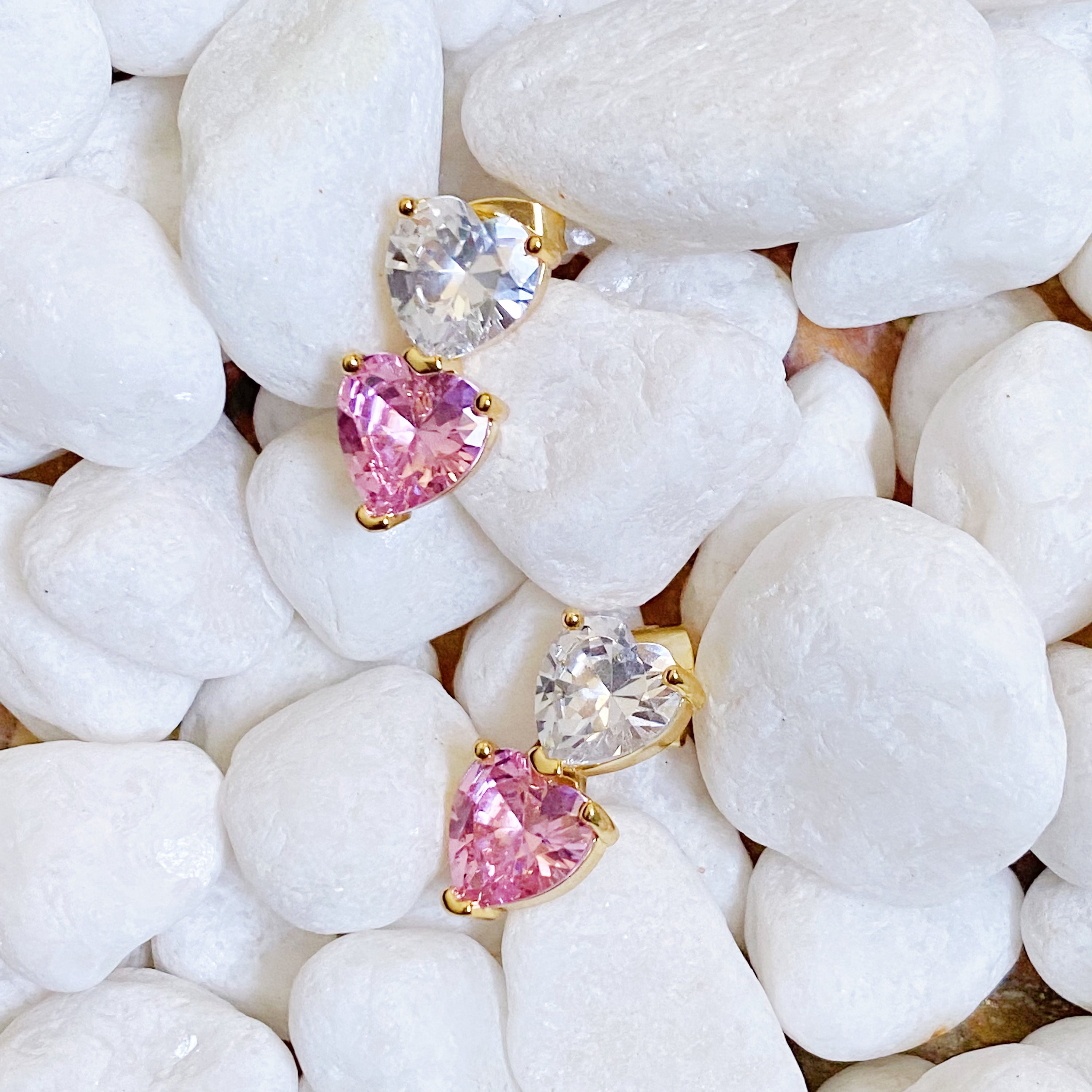 Two Colors Of Love Earrings featuring a sparkling two-toned heart design, crafted from gold plated brass with cubic zirconia.