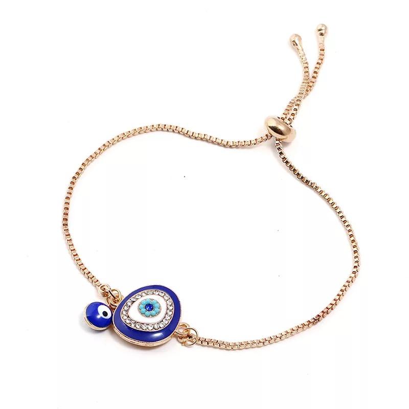 Two is Better Than One Evil Eye Adjustable Bracelet featuring large and small evil eye charms on a stylish adjustable band.