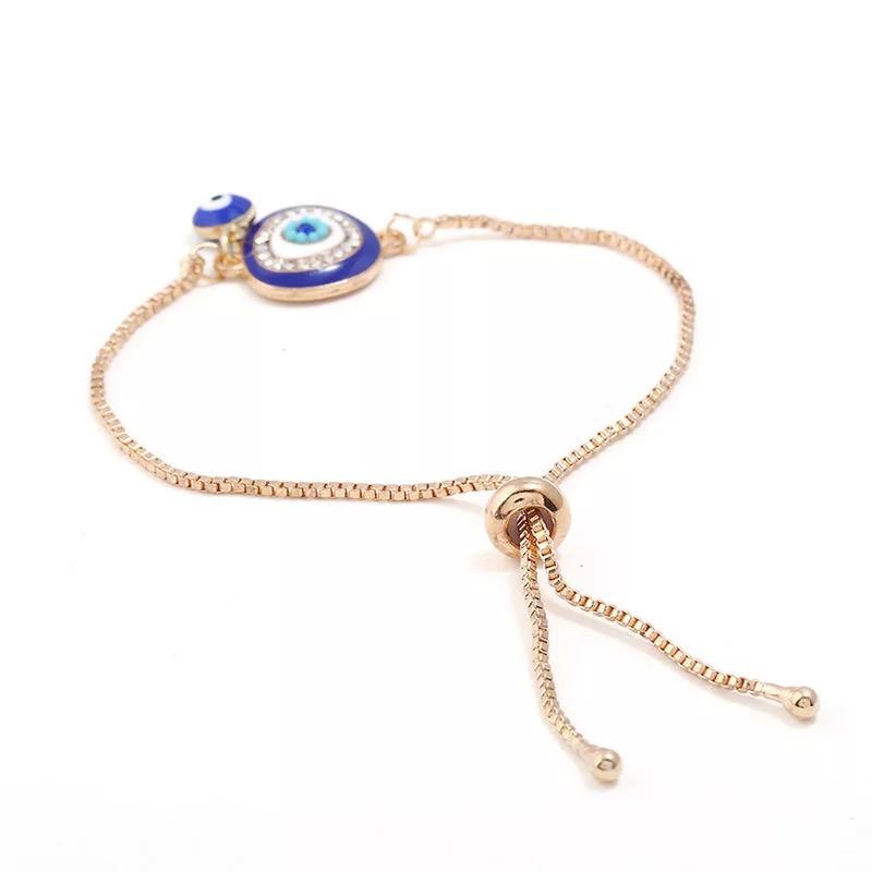 Two is Better Than One Evil Eye Adjustable Bracelet featuring large and small evil eye charms on a stylish adjustable band.