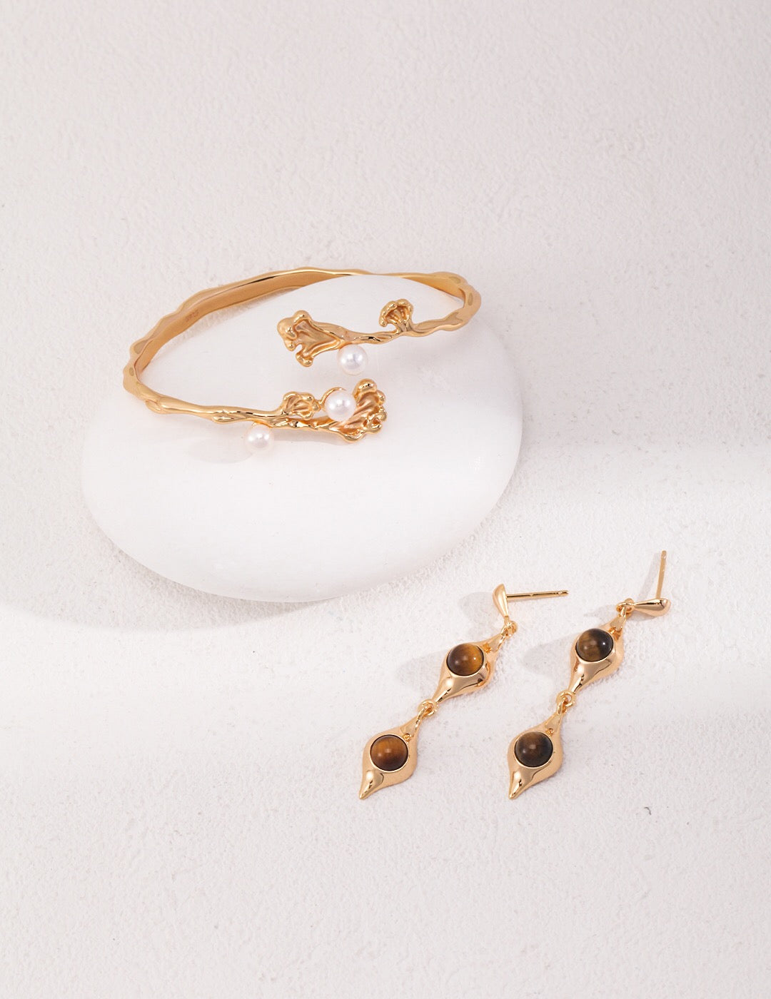 Gold bracelet and earrings set.